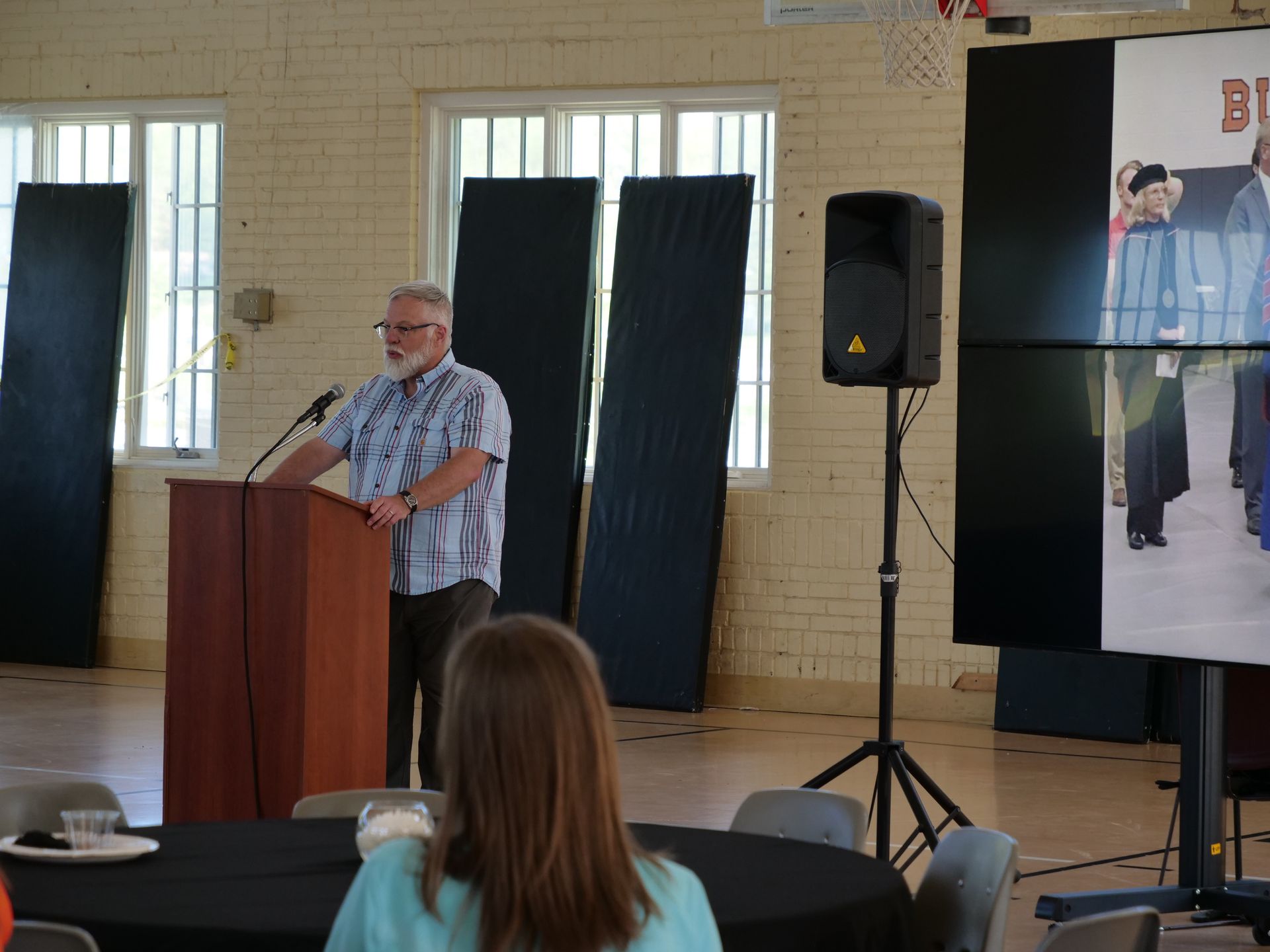 Andy Messer speaking at the podium.