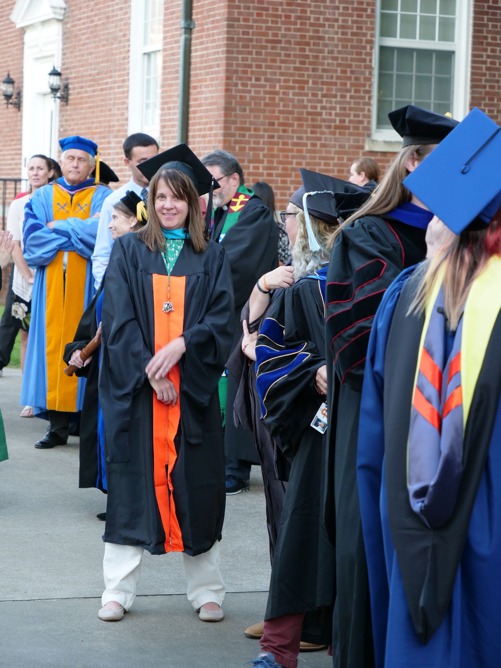 Faculty lined up outside of Pfeiffer Hall.