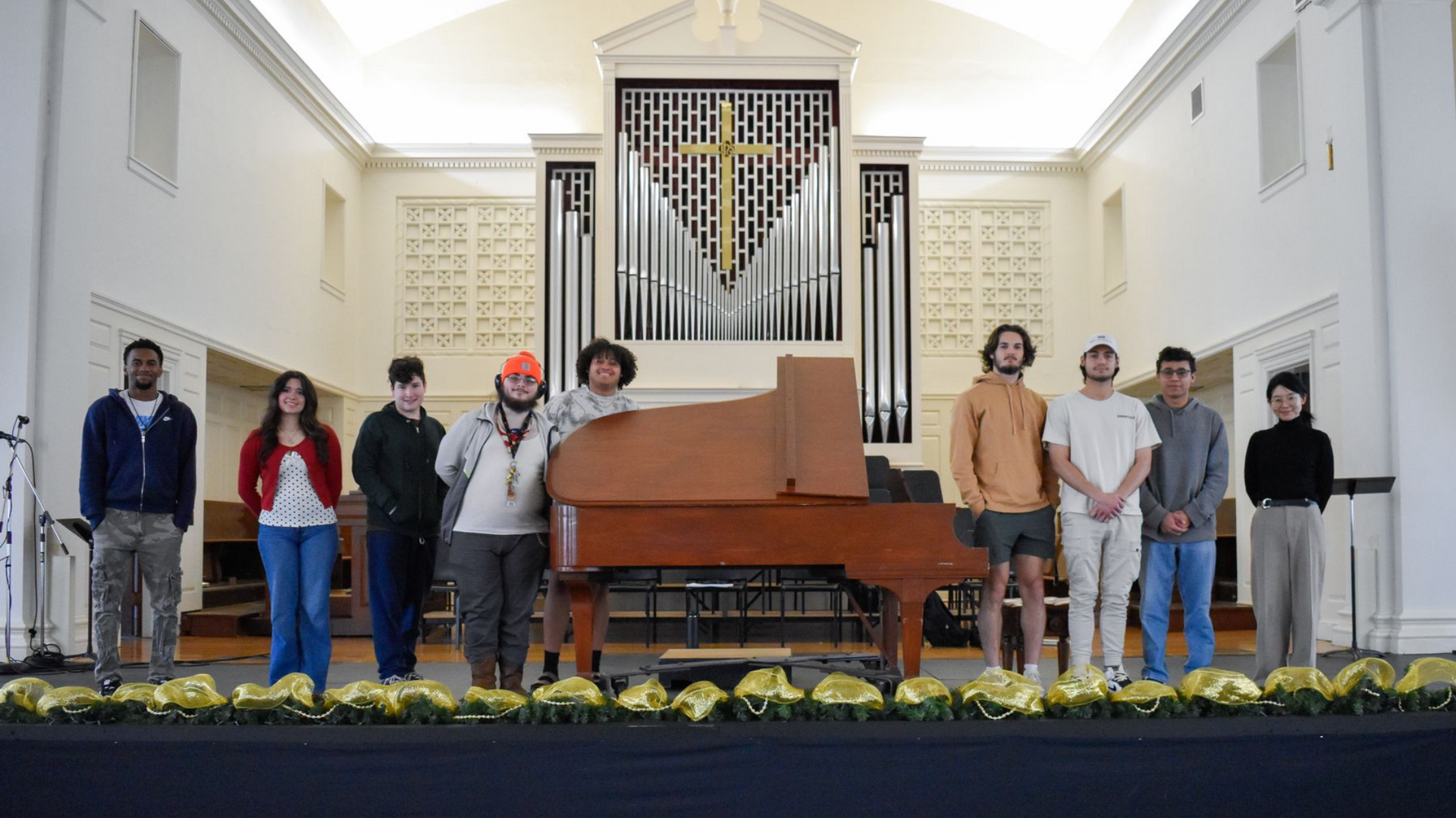 Dr. Yukiko Fujimura on stage in Conway Boatman Chapel with her UCU piano class.
