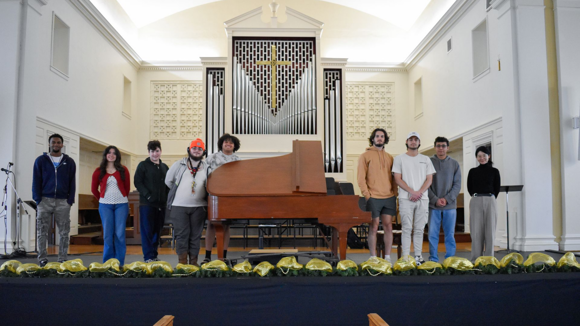 Dr. Yukiko Fujimura on stage in Conway Boatman Chapel with her UCU piano class.