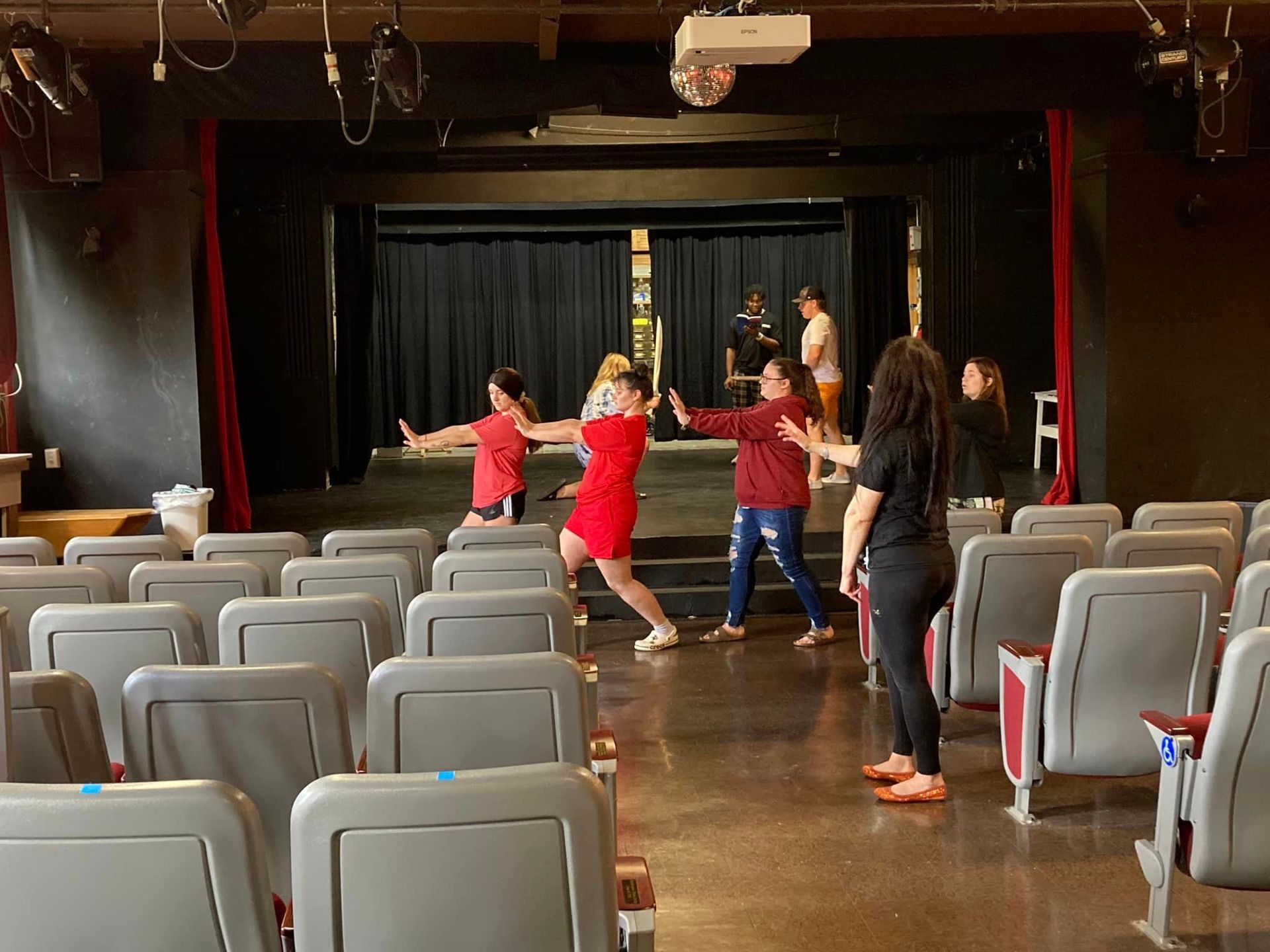 Actors practice a dance scene under the guidance of Stella Rostkowski.
