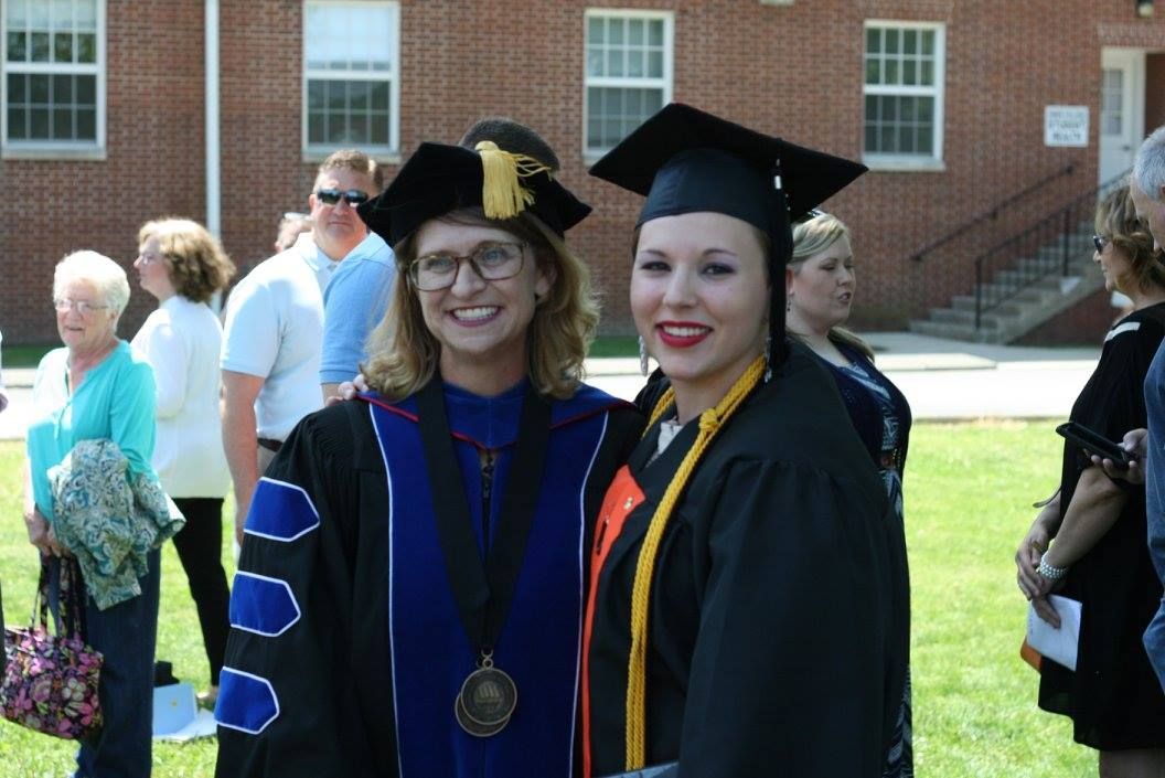 Dr. Christine Marley-Frederick standing with a graduating student.