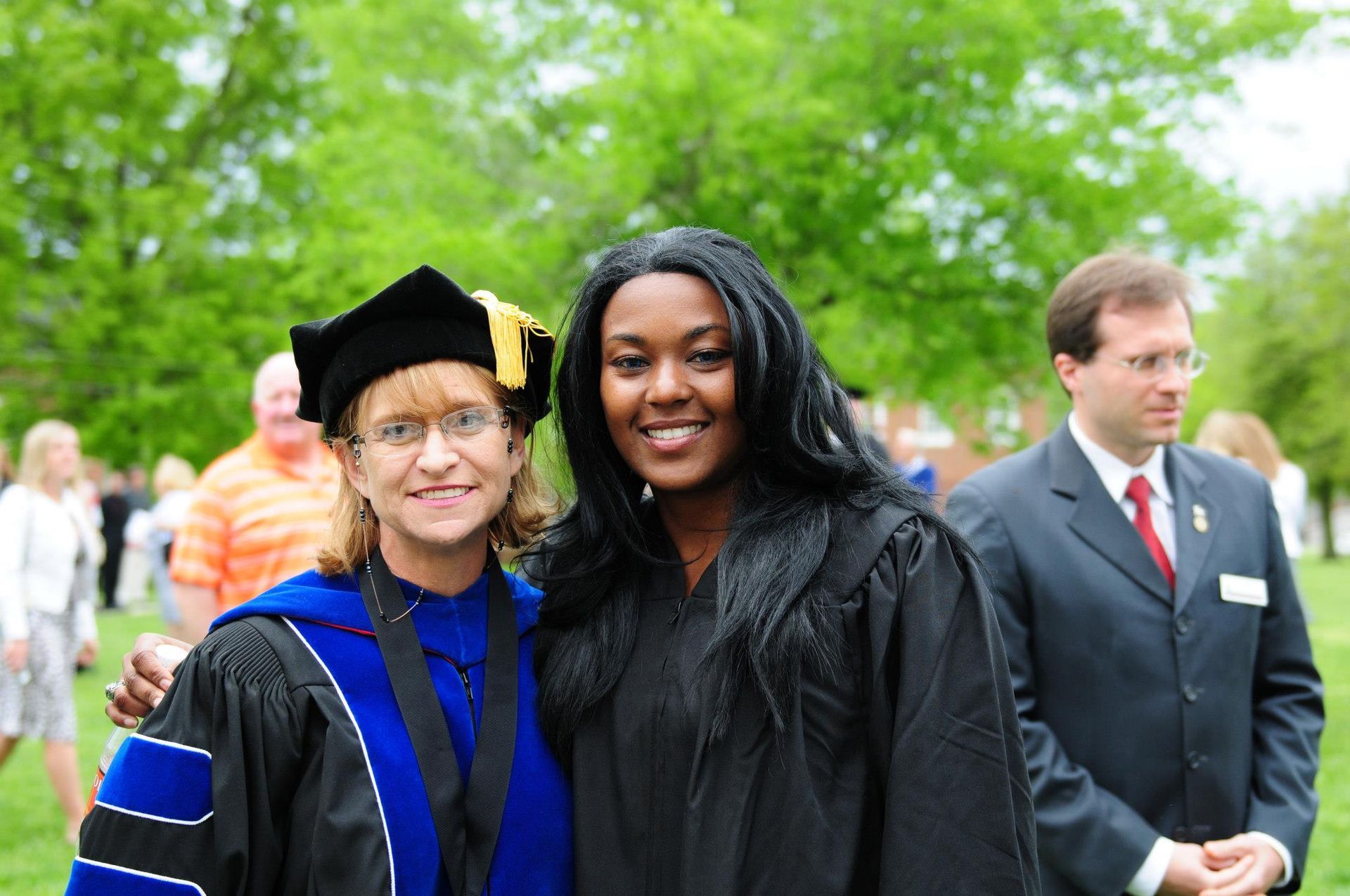 Dr. Christine Marley-Frederick standing with a graduating student.