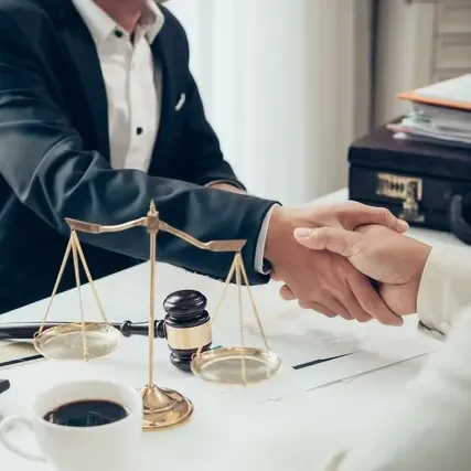 Attorney Handshakes A Person - West Des Moines, IA - Hopkins Law Office