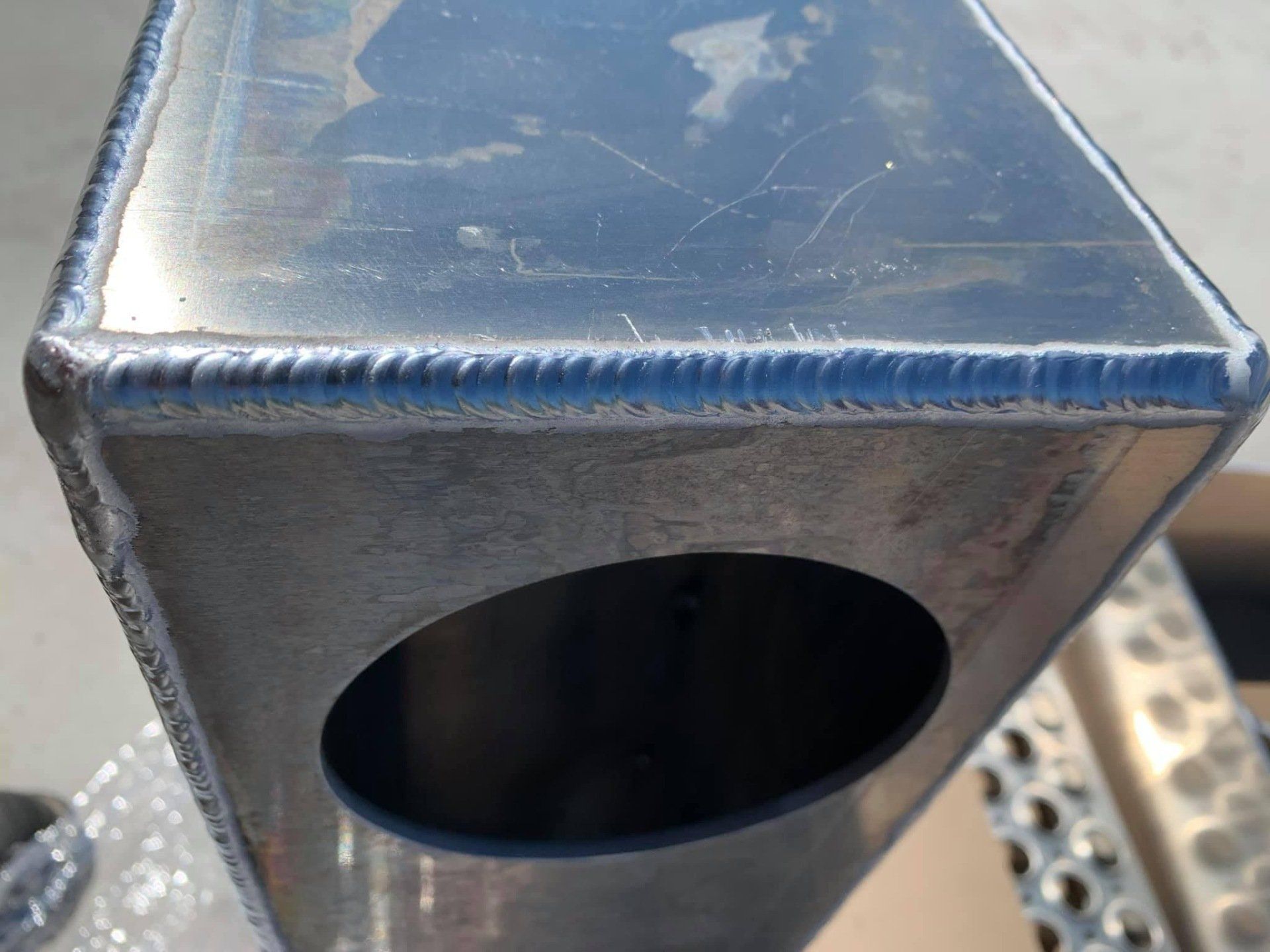 A close up of a metal object with a hole in the middle
