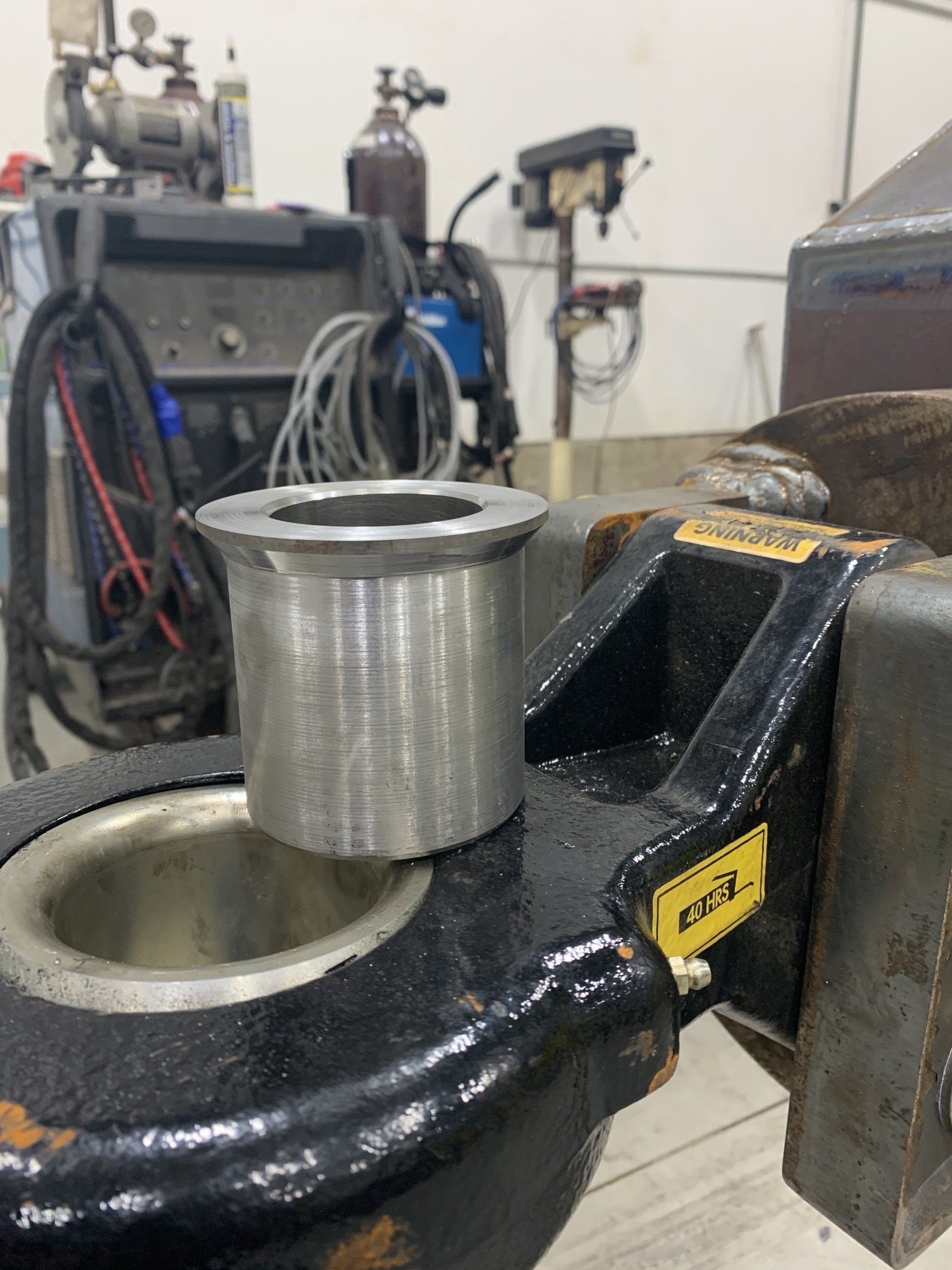 A metal object with a yellow sticker that says 1337