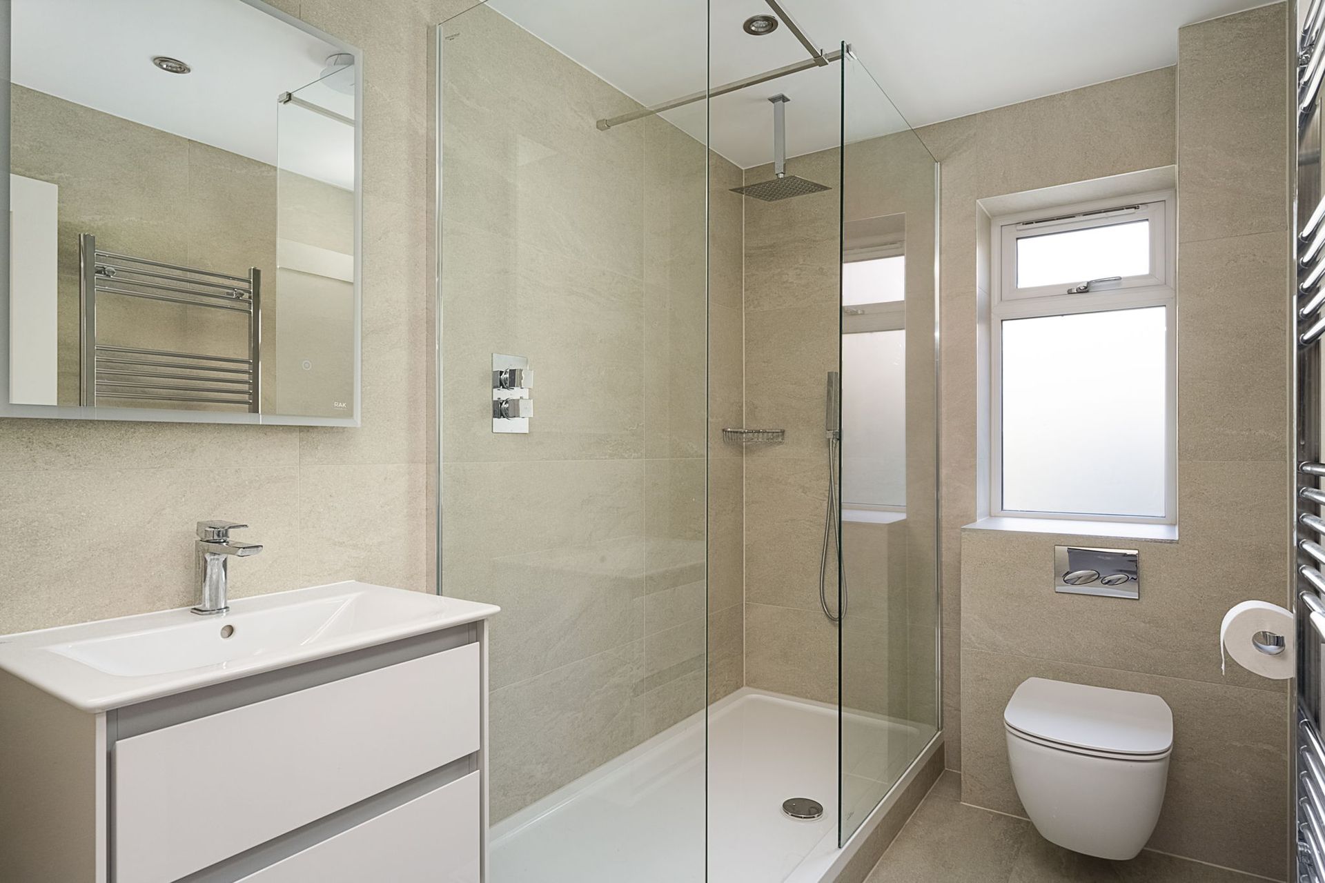 Harvey contemporary kitchen with grey, handleless units and teal furnishings. Designed by exact Kitchens in Wokingham.