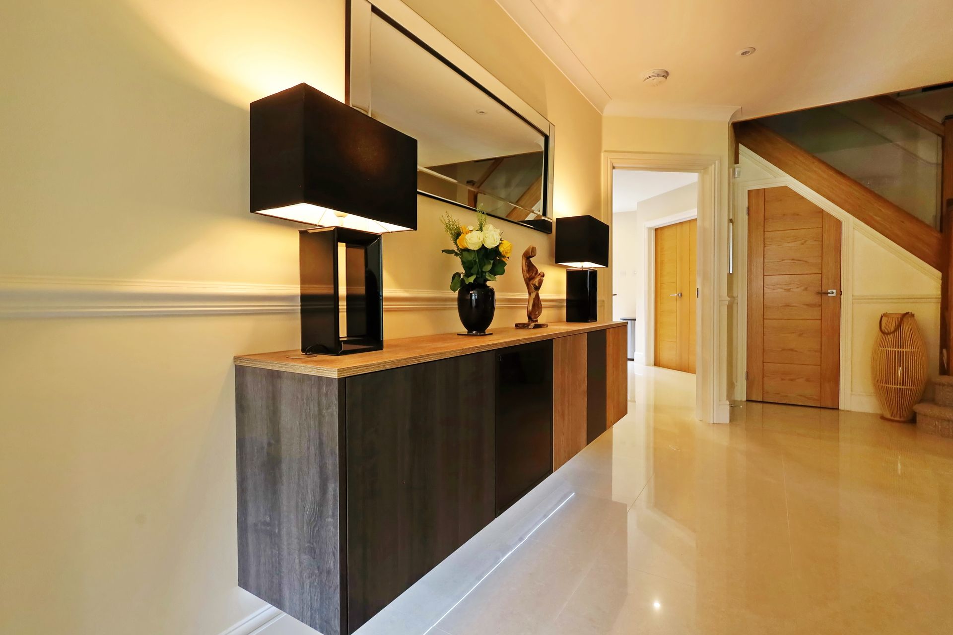 Harvey contemporary kitchen with grey, handleless units and teal furnishings. Designed by exact Kitchens in Wokingham.