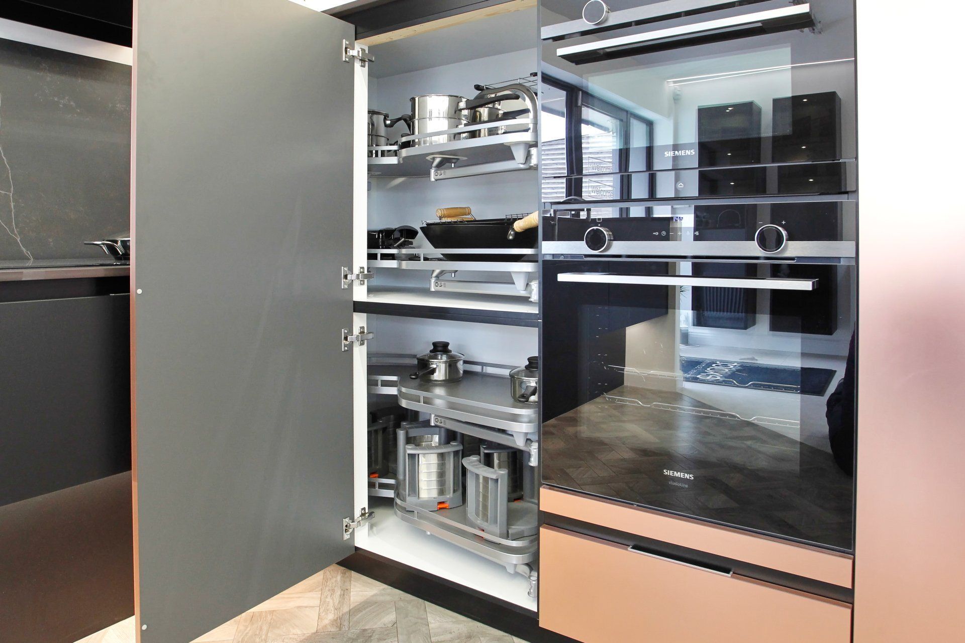 COner cupboard unit in a bronze contemporary kitchen by exact