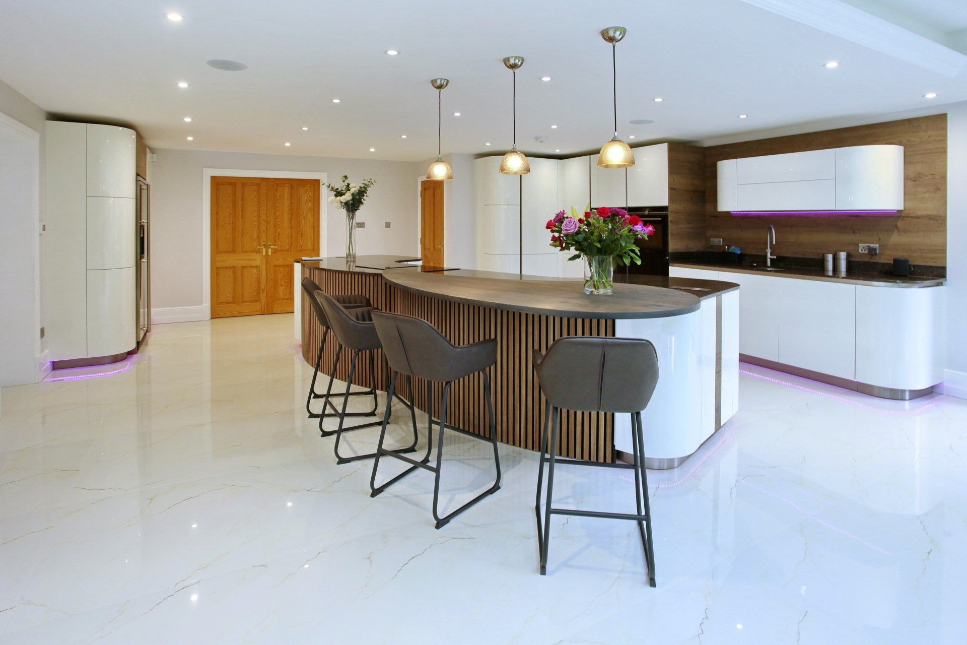 White gloss and dark wood handleless kitchen by exact