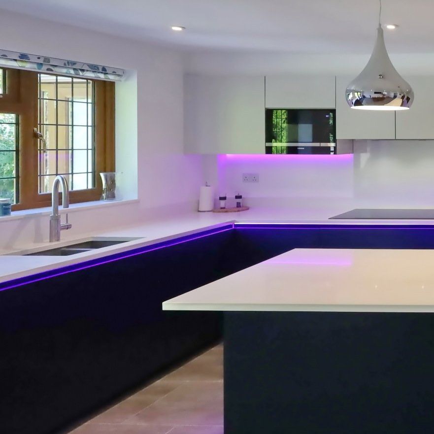 Harvey contemporary kitchen with grey, handleless units and teal furnishings. Designed by exact Kitchens in Wokingham.