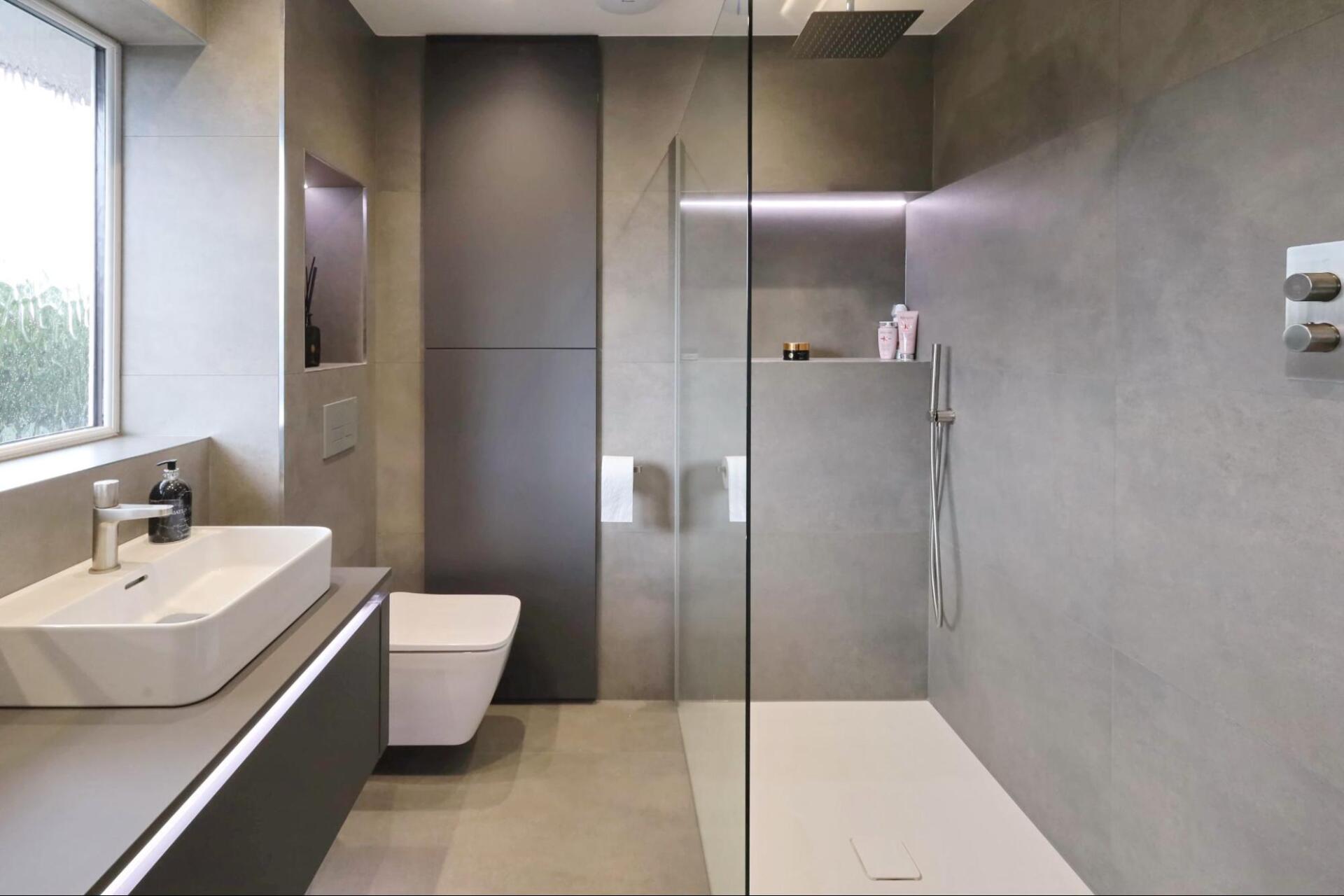 Bathroom with repeated tiles on the floor and walls by exact