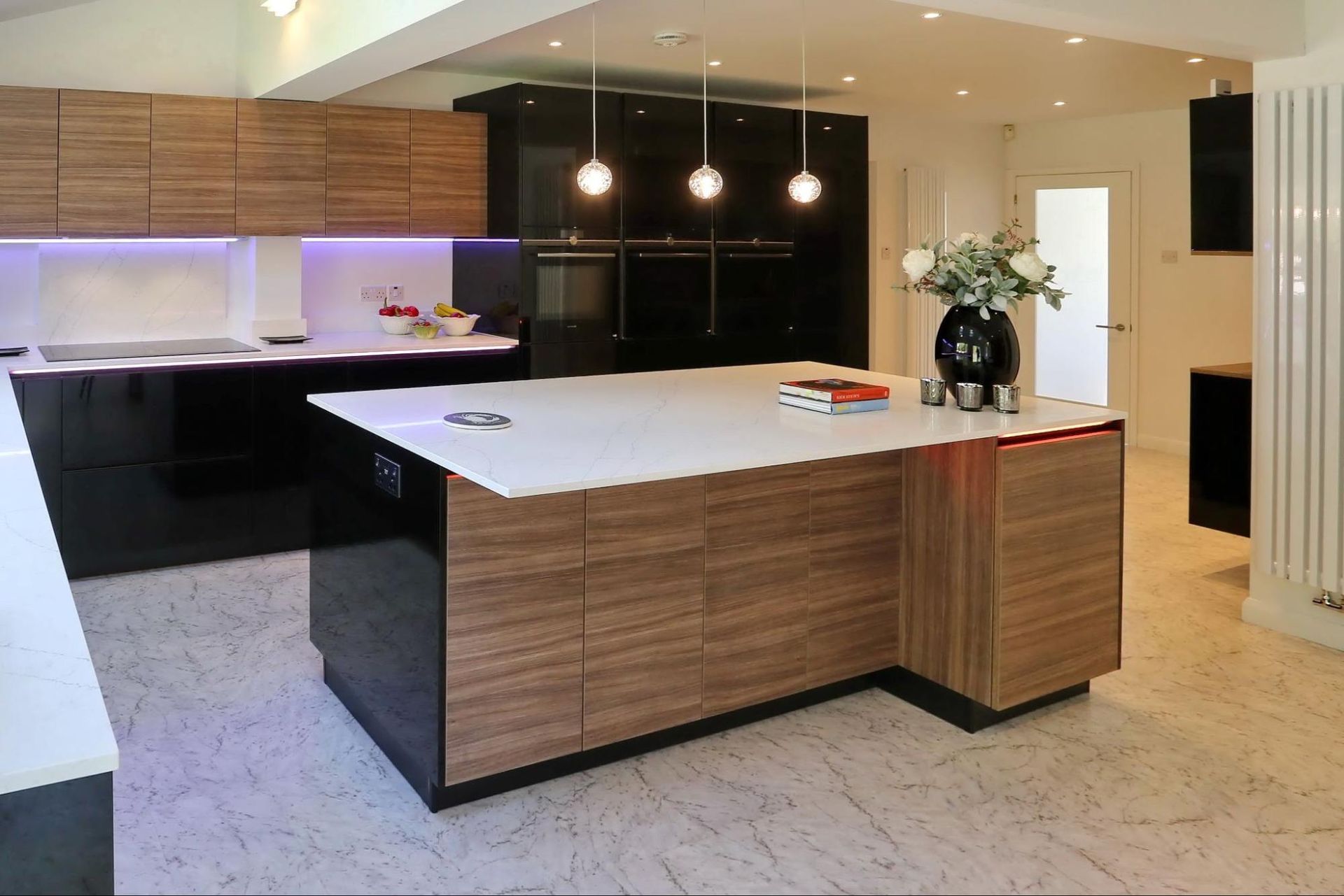 White gloss and dark wood handleless kitchen by exact