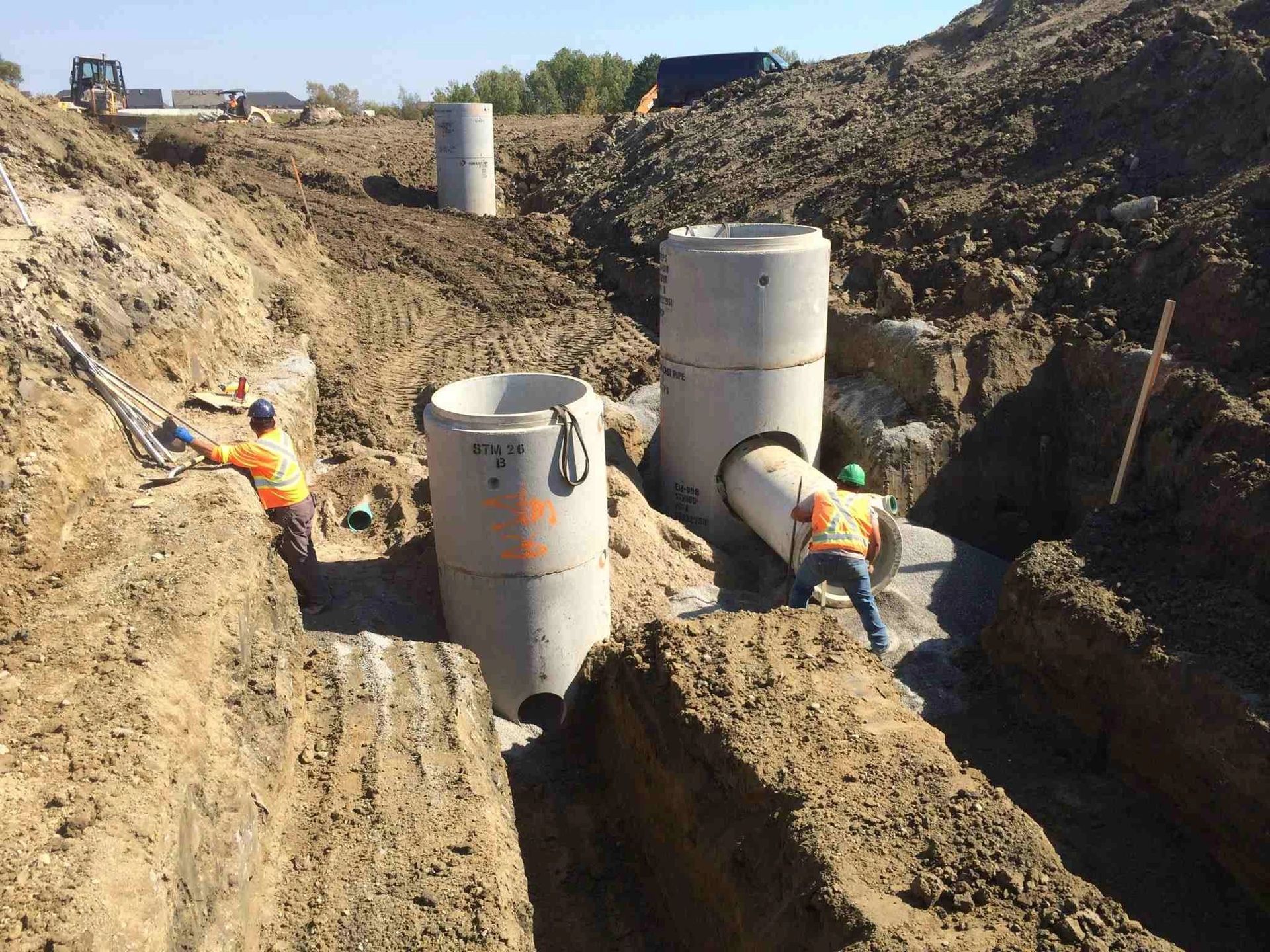 A group of construction workers are working on a construction site.