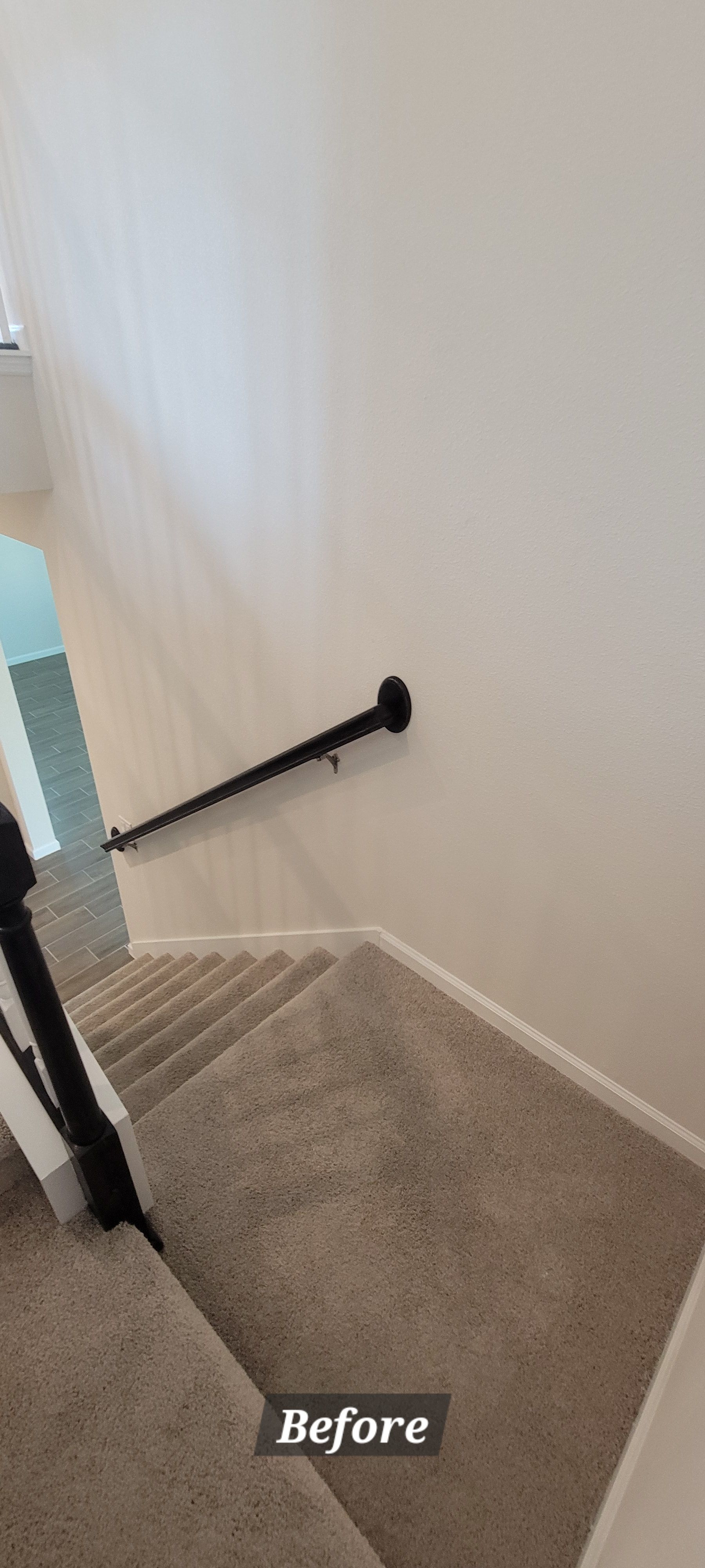 A picture of a staircase before being painted.