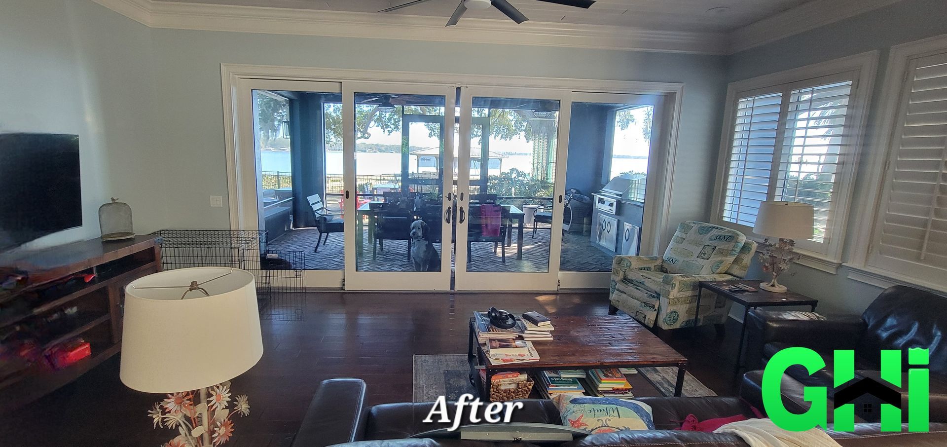 A living room with a lot of furniture and sliding glass doors.