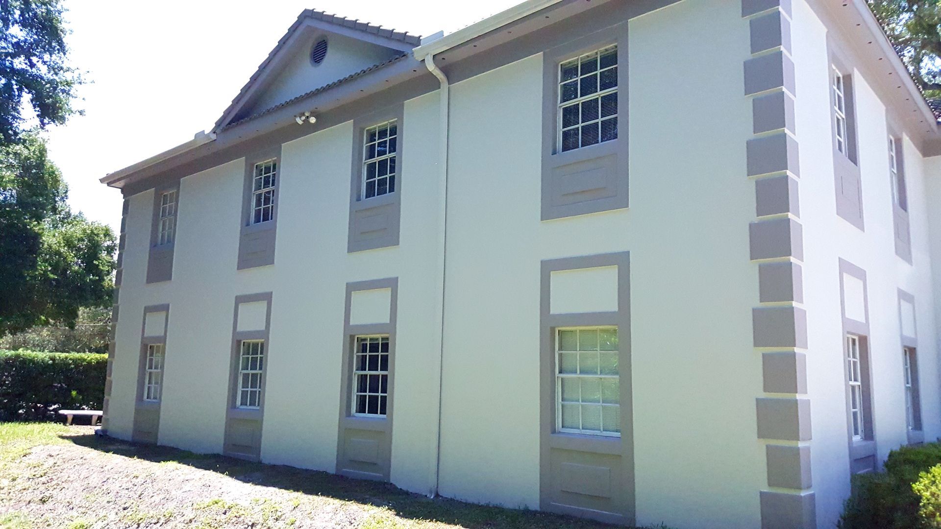 A large white building with a lot of windows