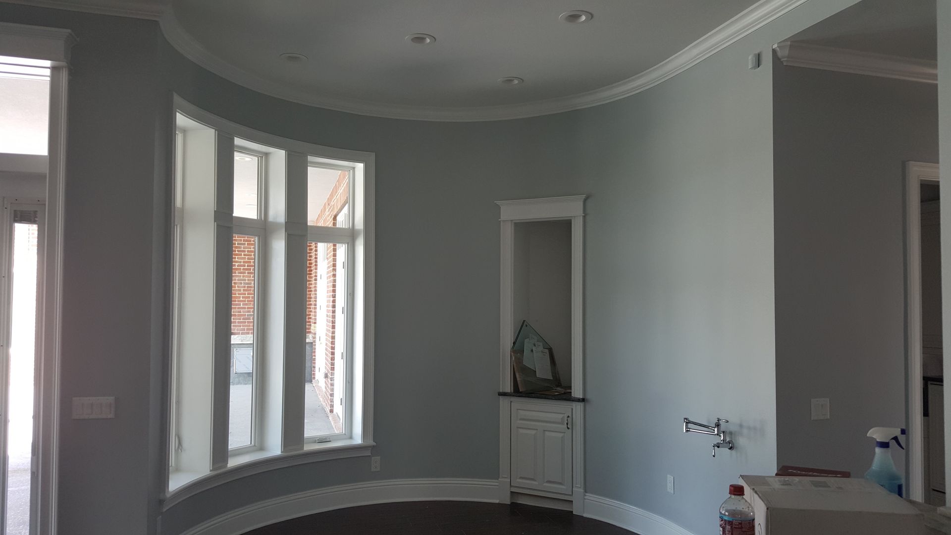 A room with a lot of windows and a curved ceiling.