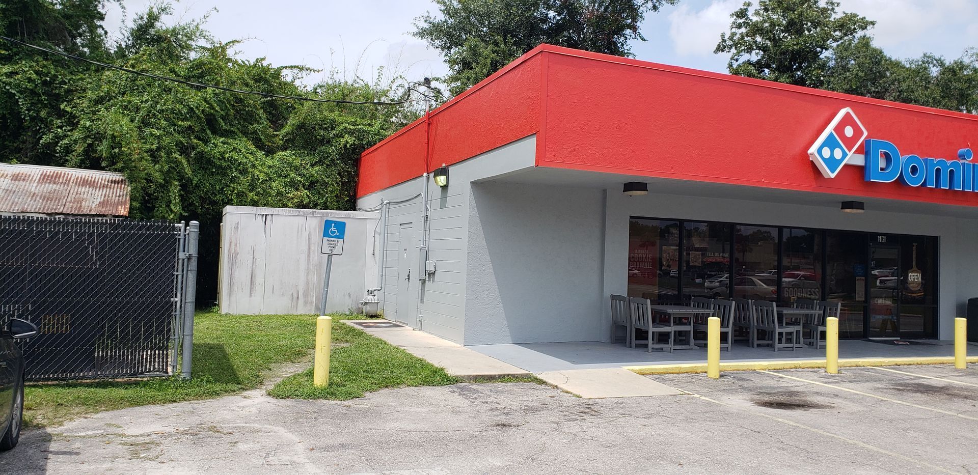 A domino 's pizza restaurant with a red roof