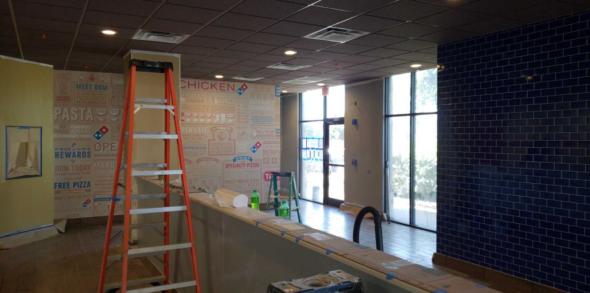 A ladder is sitting in the middle of a room.