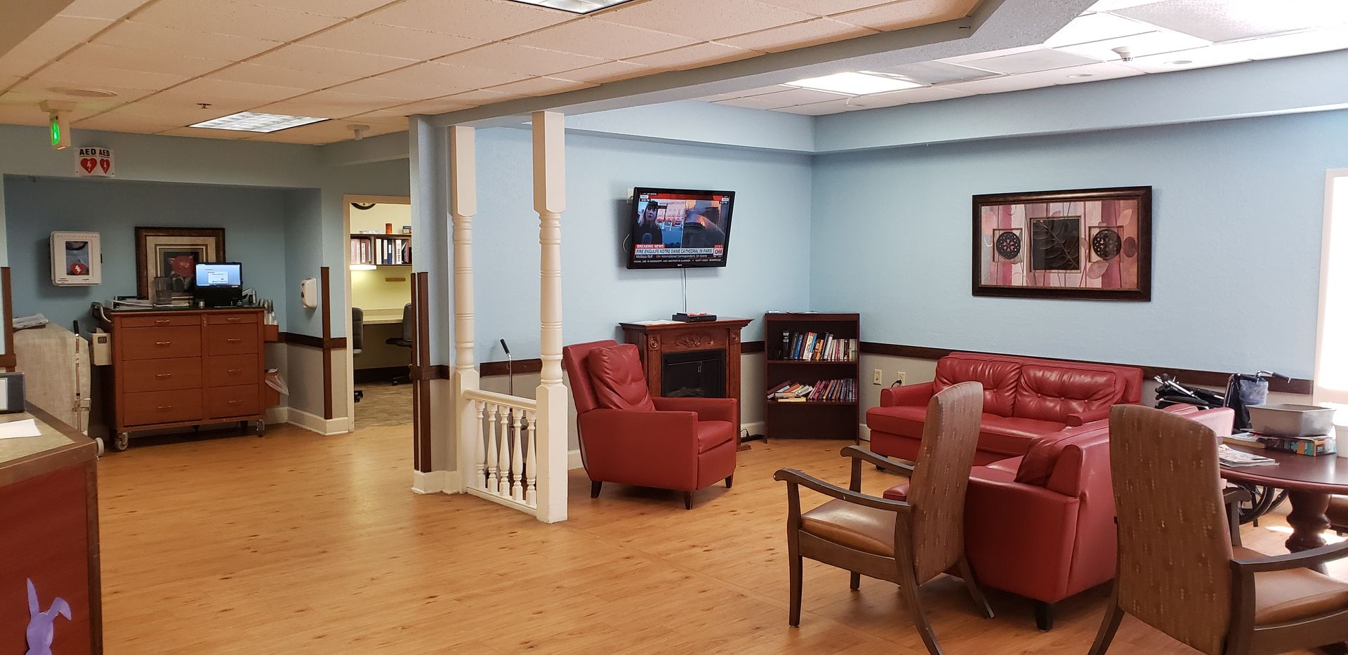A living room filled with furniture and a television.