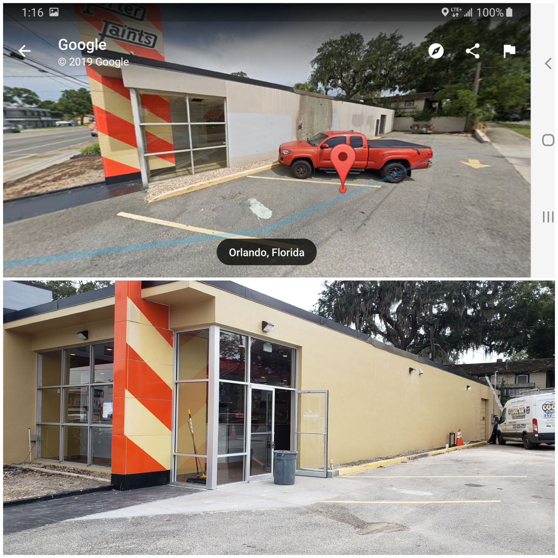 A building with a red truck parked in front of it