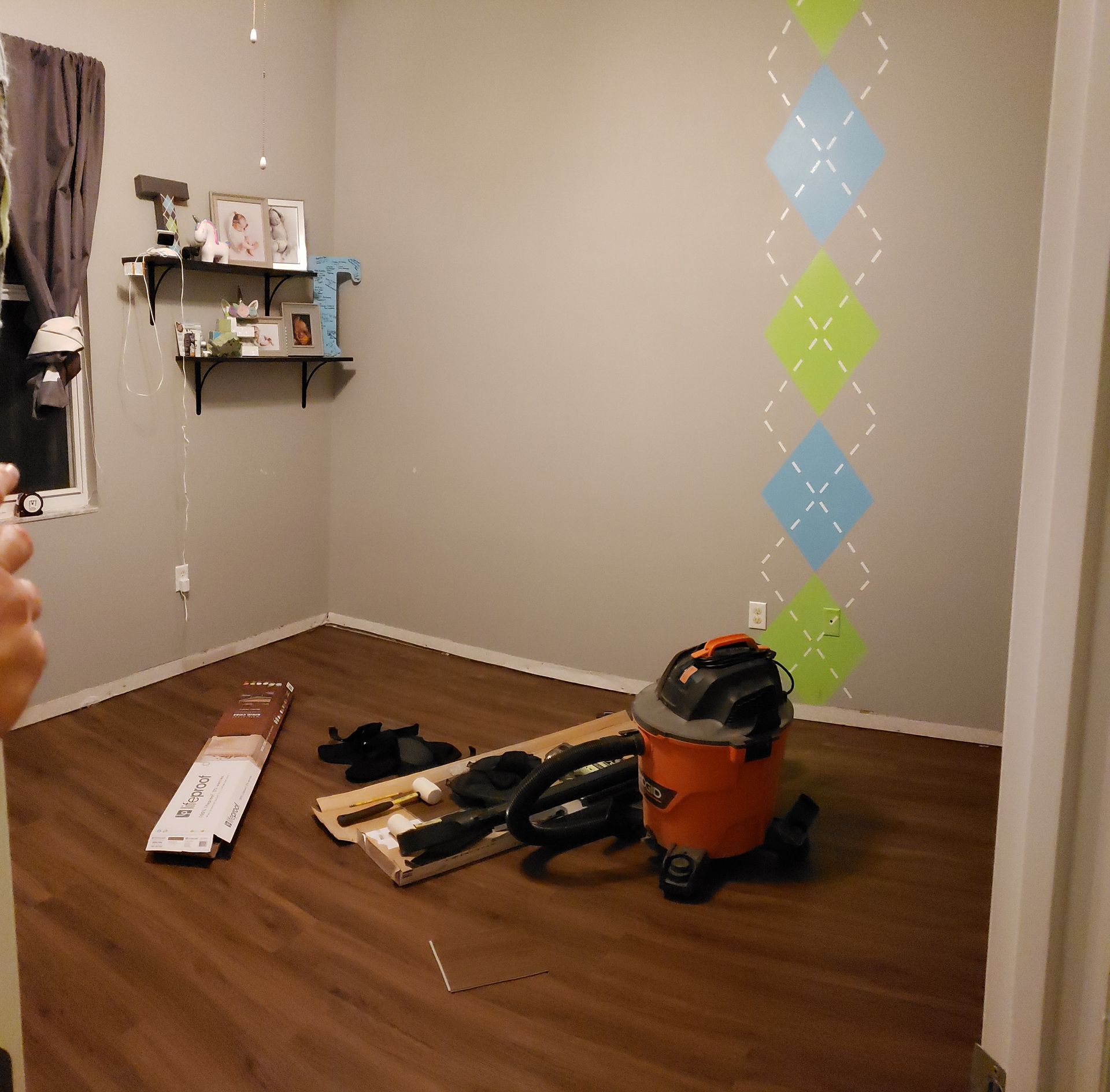 A room with a vacuum cleaner on the floor