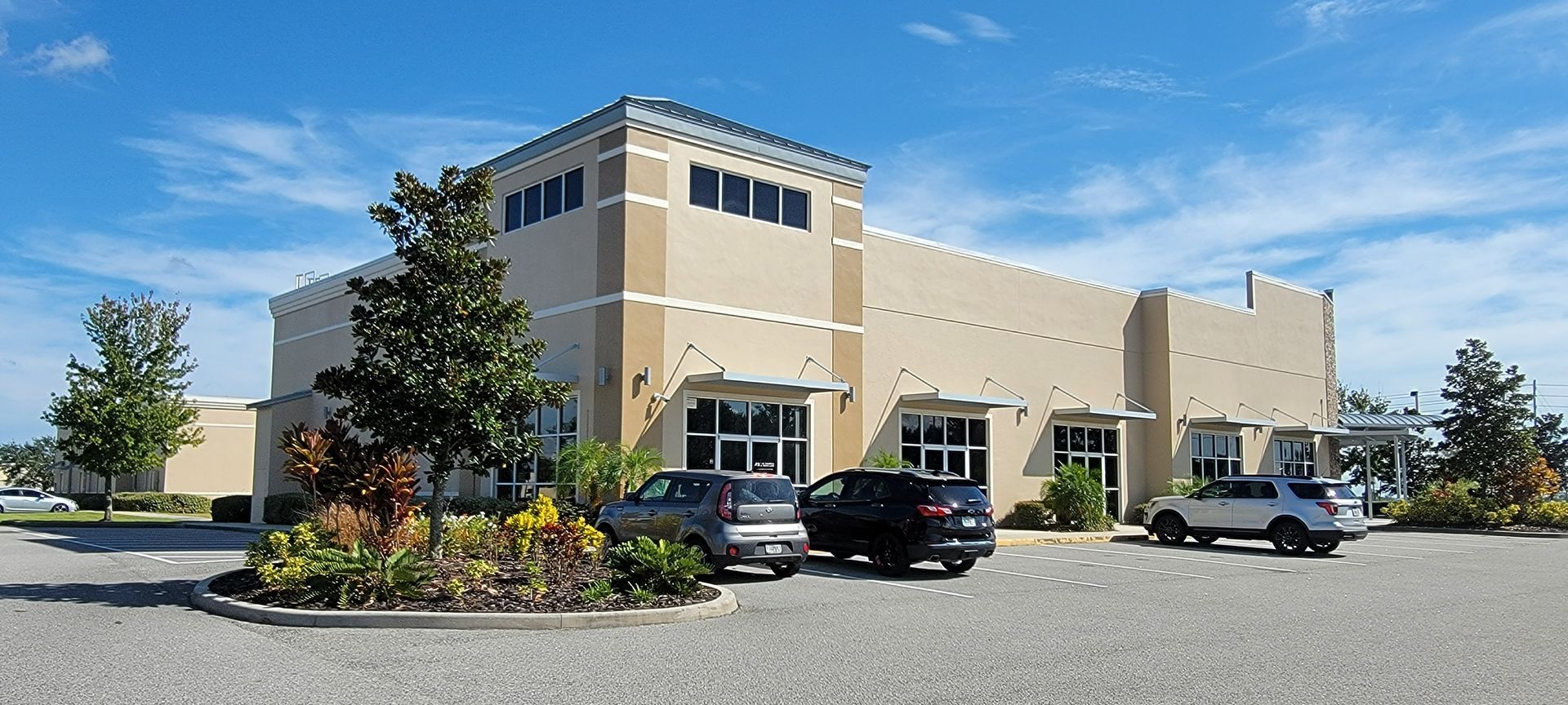 A large building with cars parked in front of it