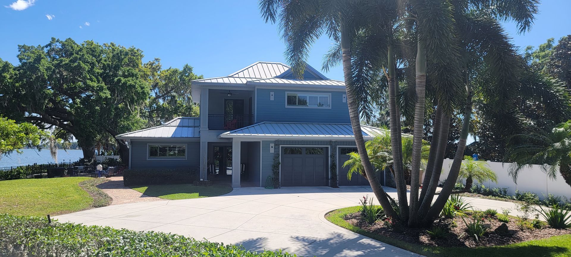 A large house with a lot of trees in front of it
