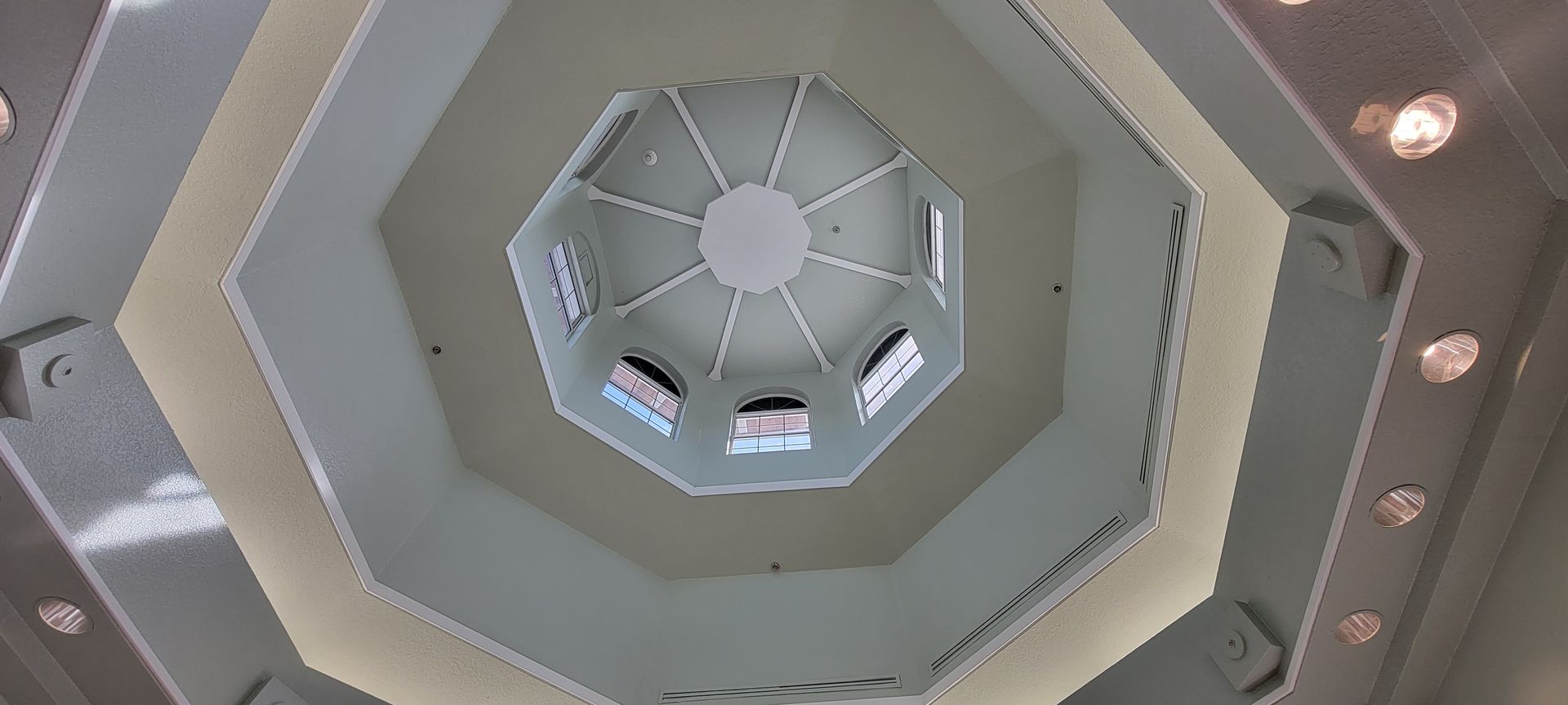 Looking up at the ceiling of a building with a dome
