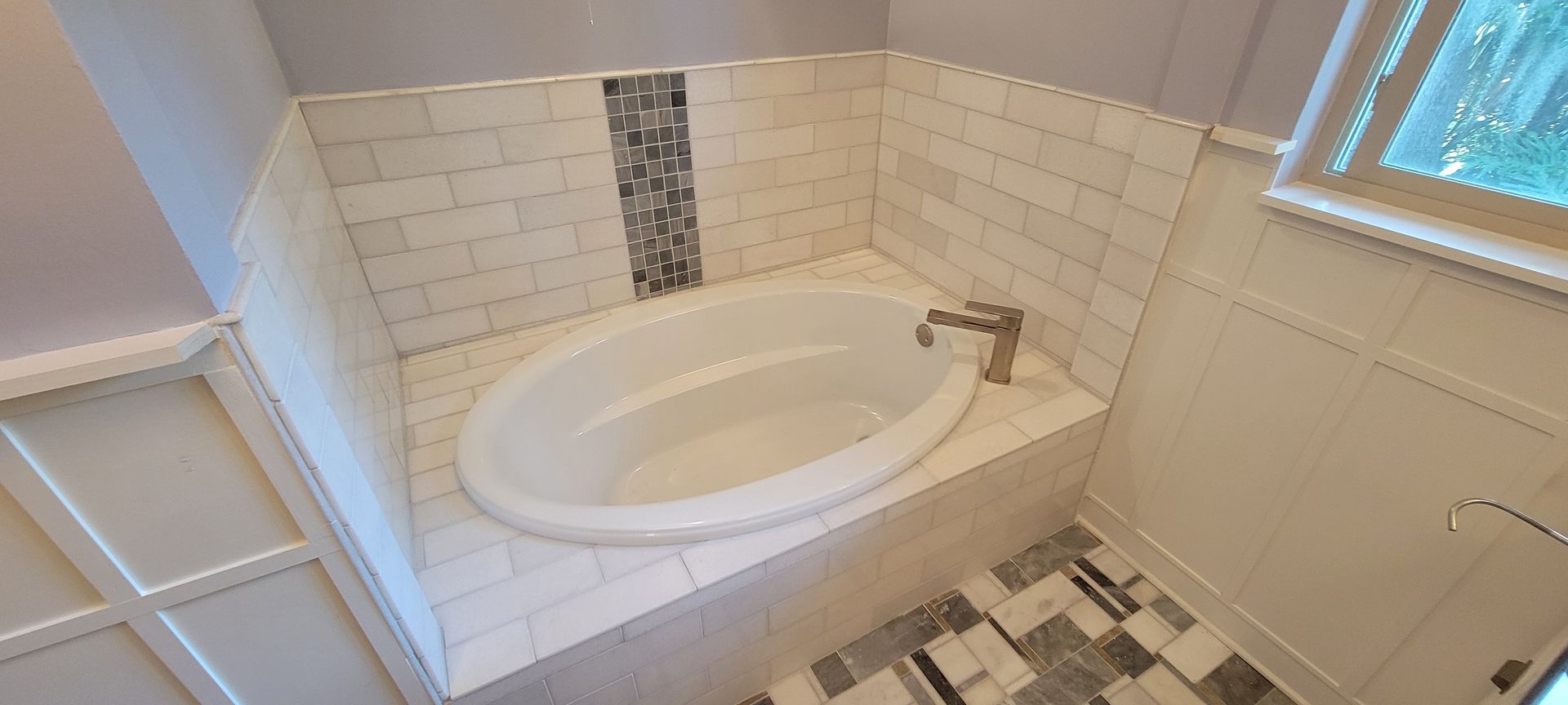 There is a bathtub in the middle of the bathroom.