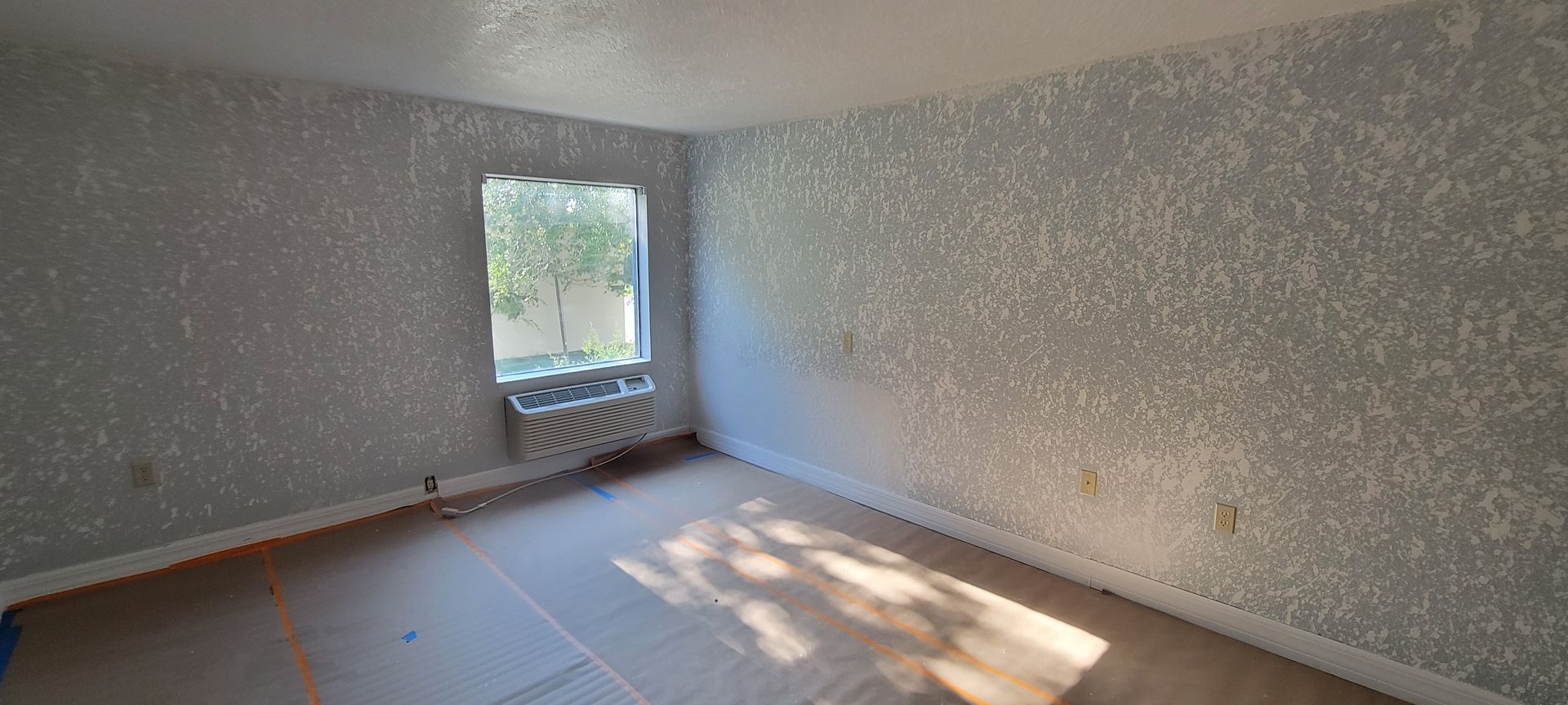 There is a window in the middle of the room.