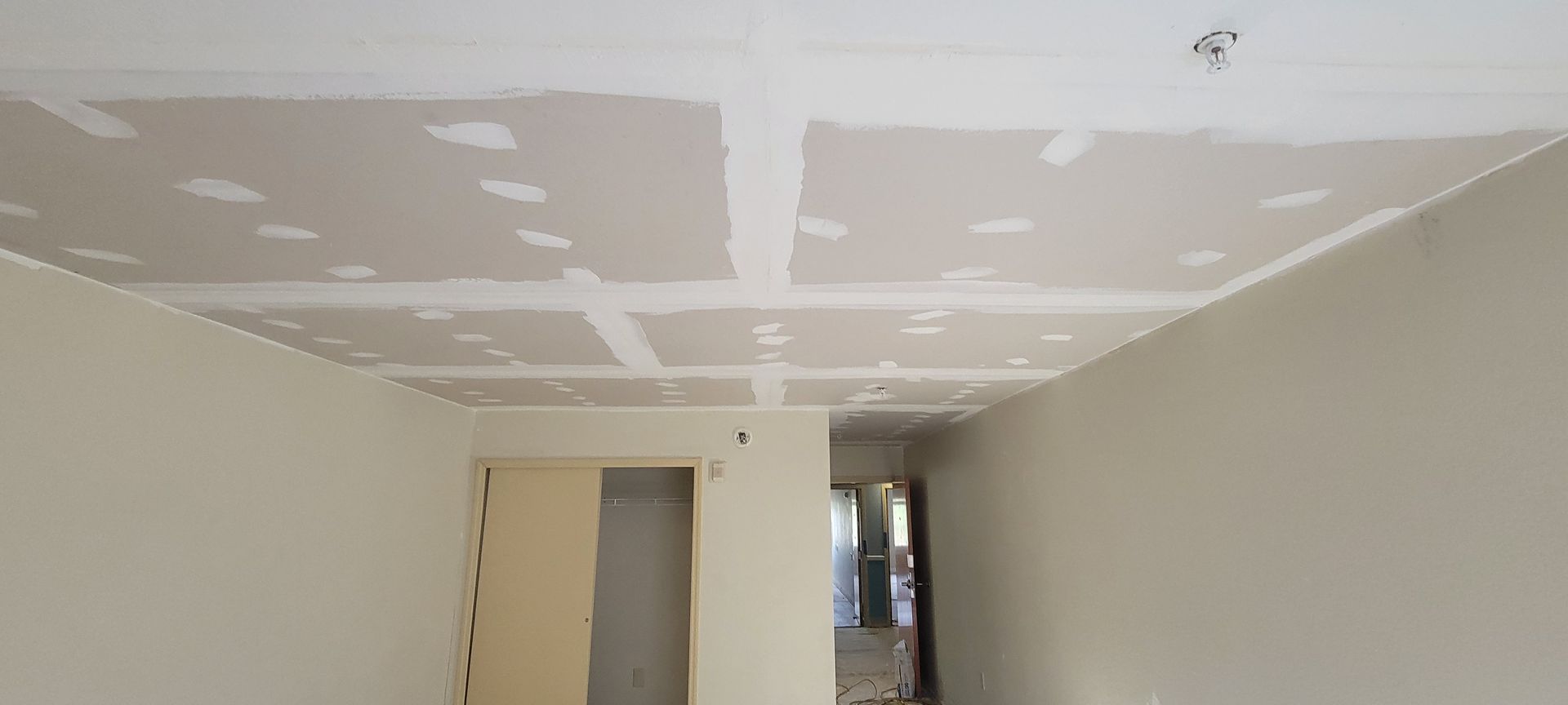 A room with a ceiling that is being remodeled.
