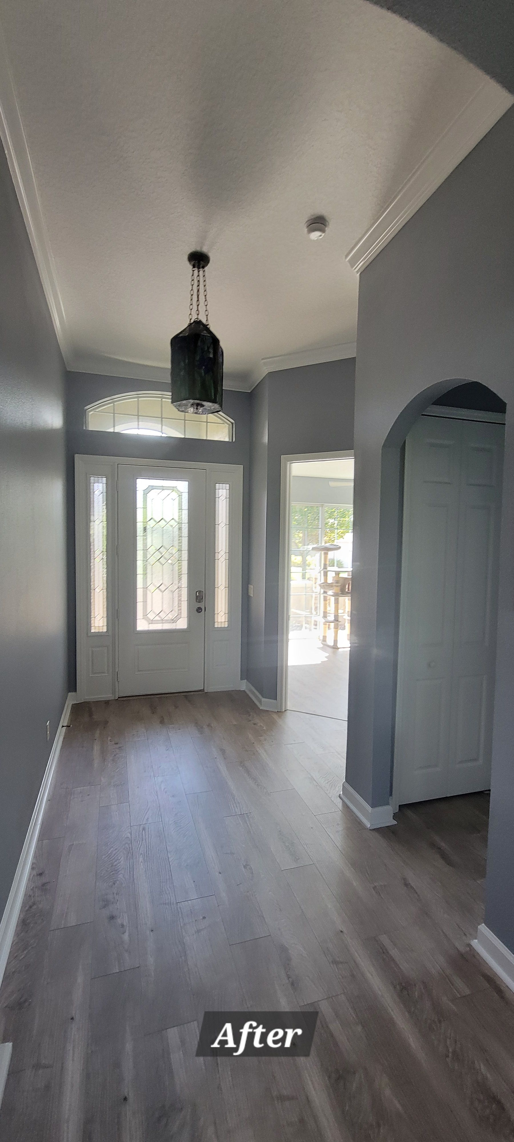 A picture of a hallway in a house after being painted.