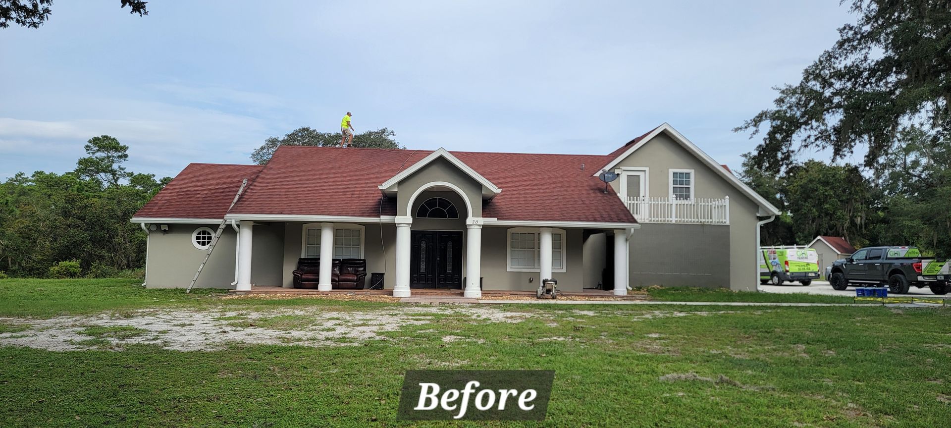 A before picture of a house with a red roof.