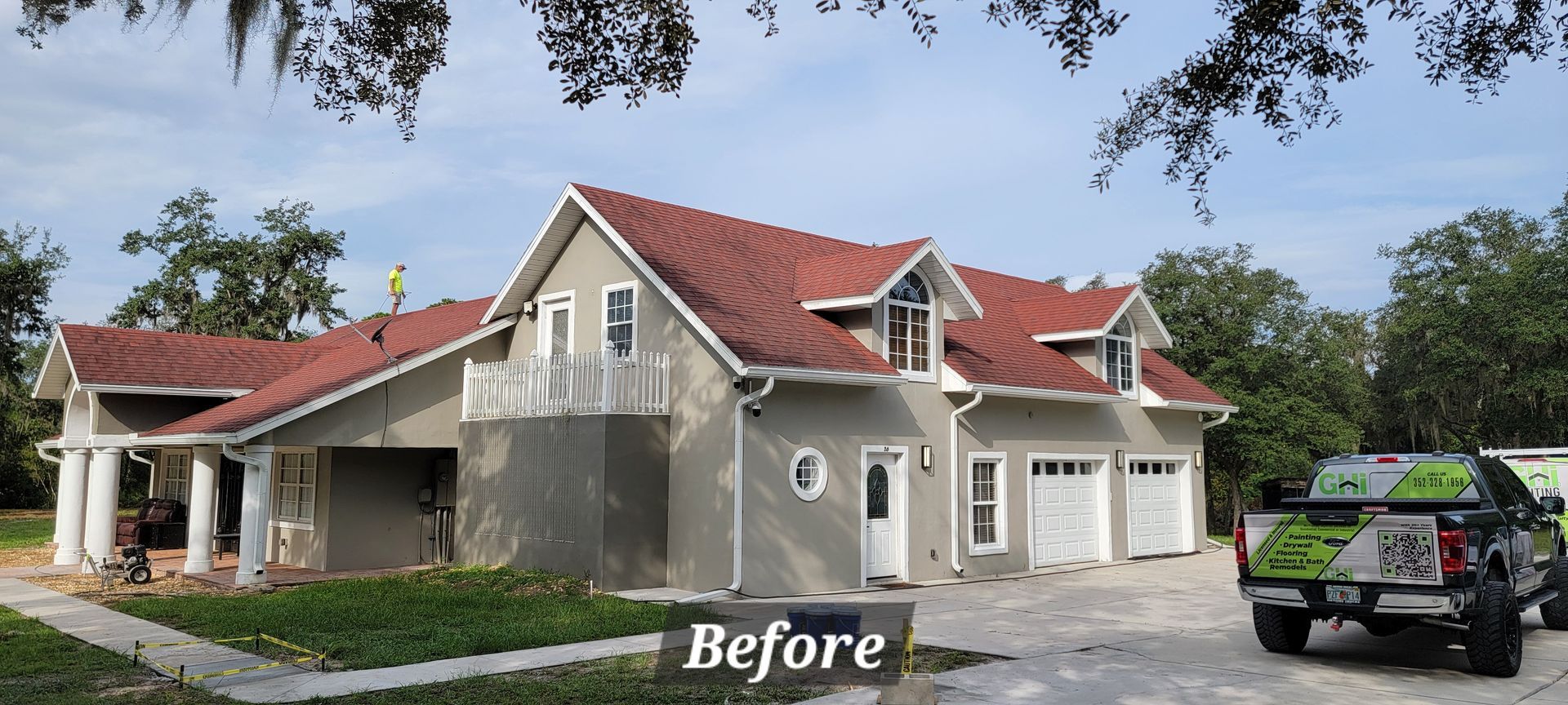 A before picture of a house with a truck parked in front of it