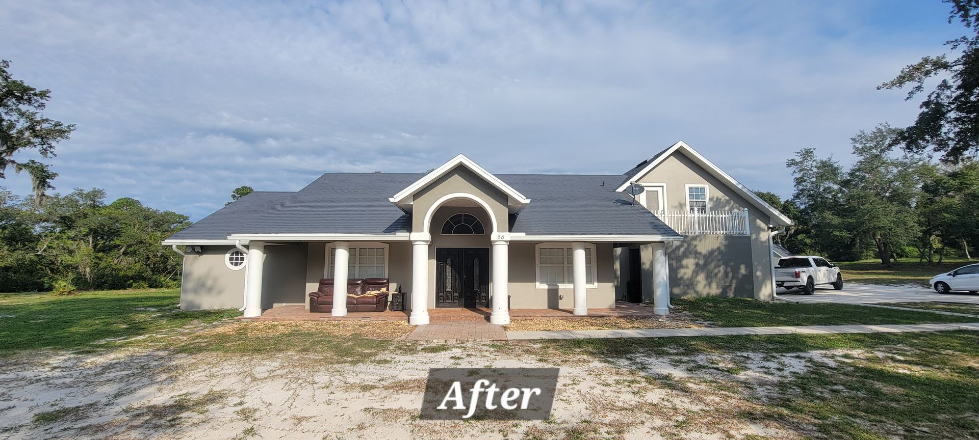 A large house with a sign that says `` after '' in front of it.