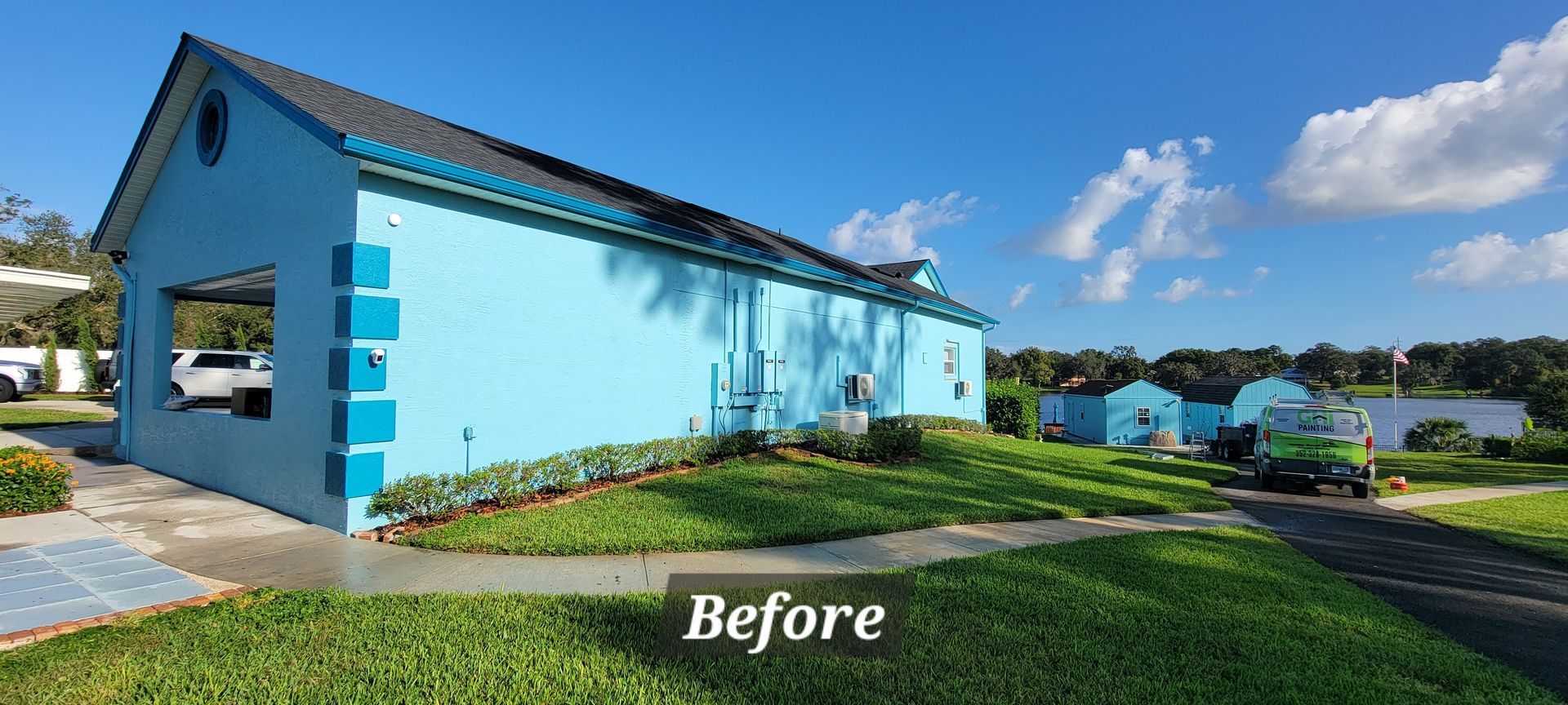 A before picture of a blue house with a black roof.