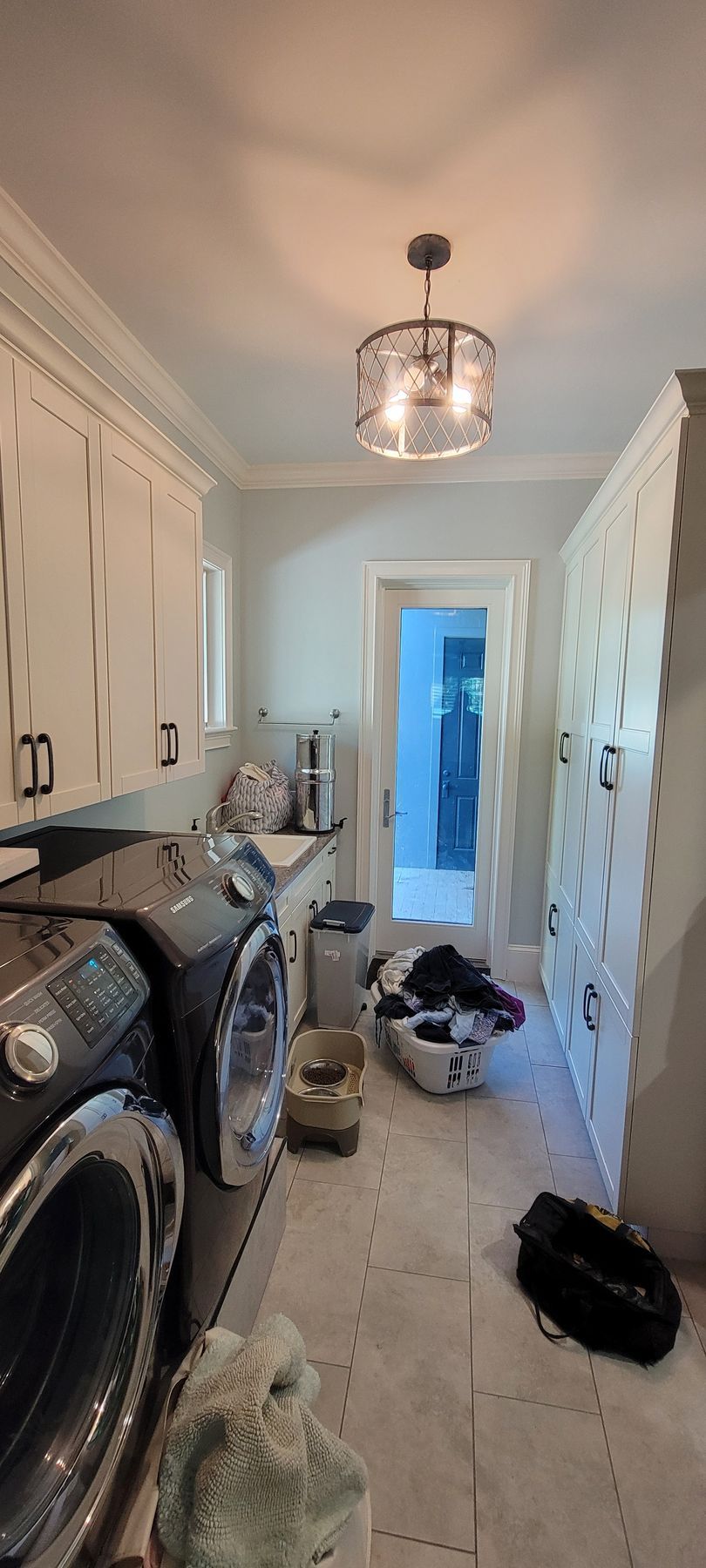A laundry room with a washer and dryer in it.
