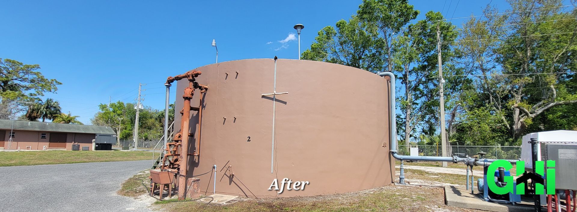 A large brown tank is sitting in the middle of a field.