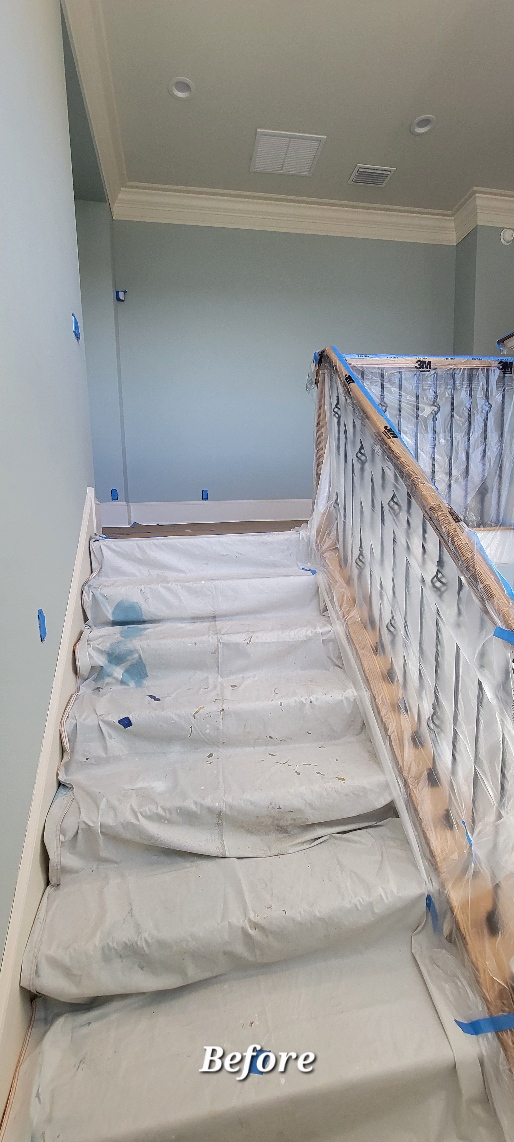 A picture of a staircase before being painted.
