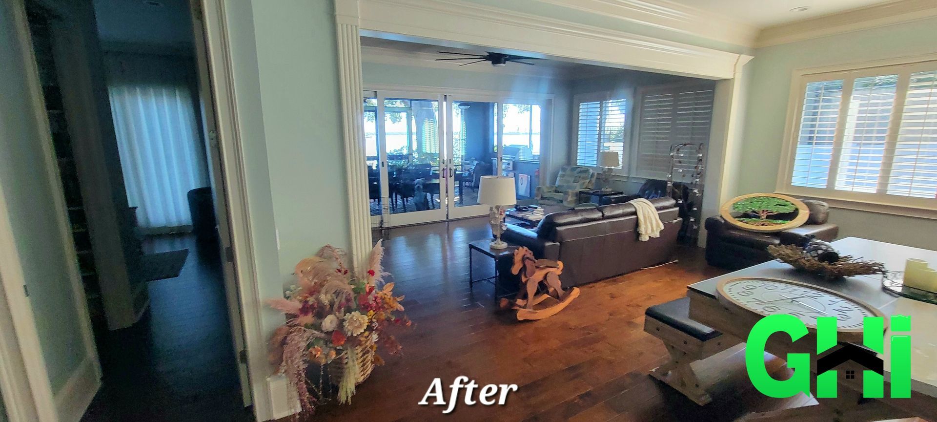 A living room with a lot of furniture and a sliding glass door.