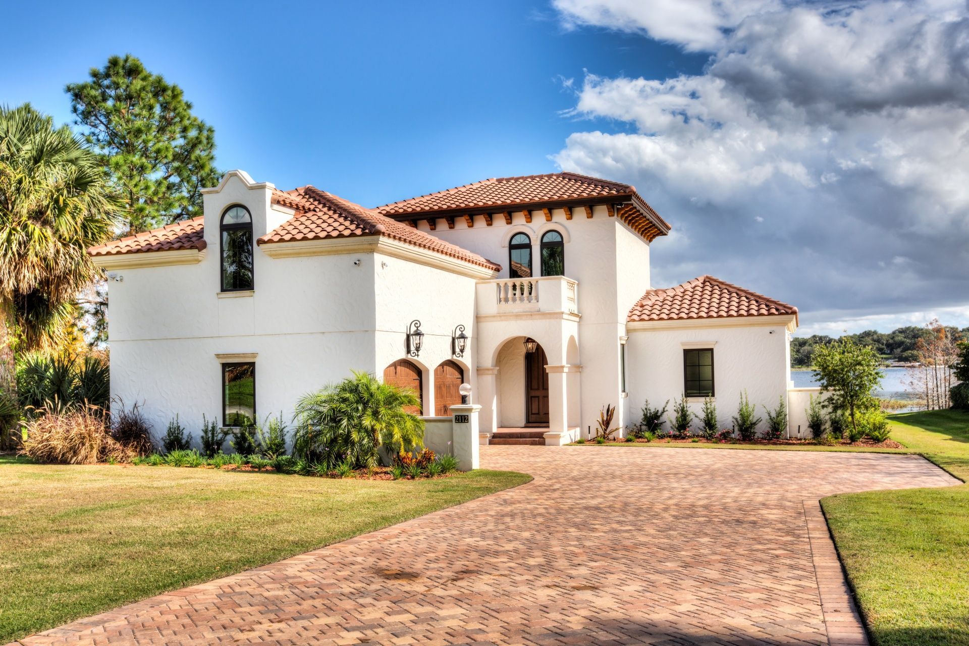 A large white house with a red tile roof