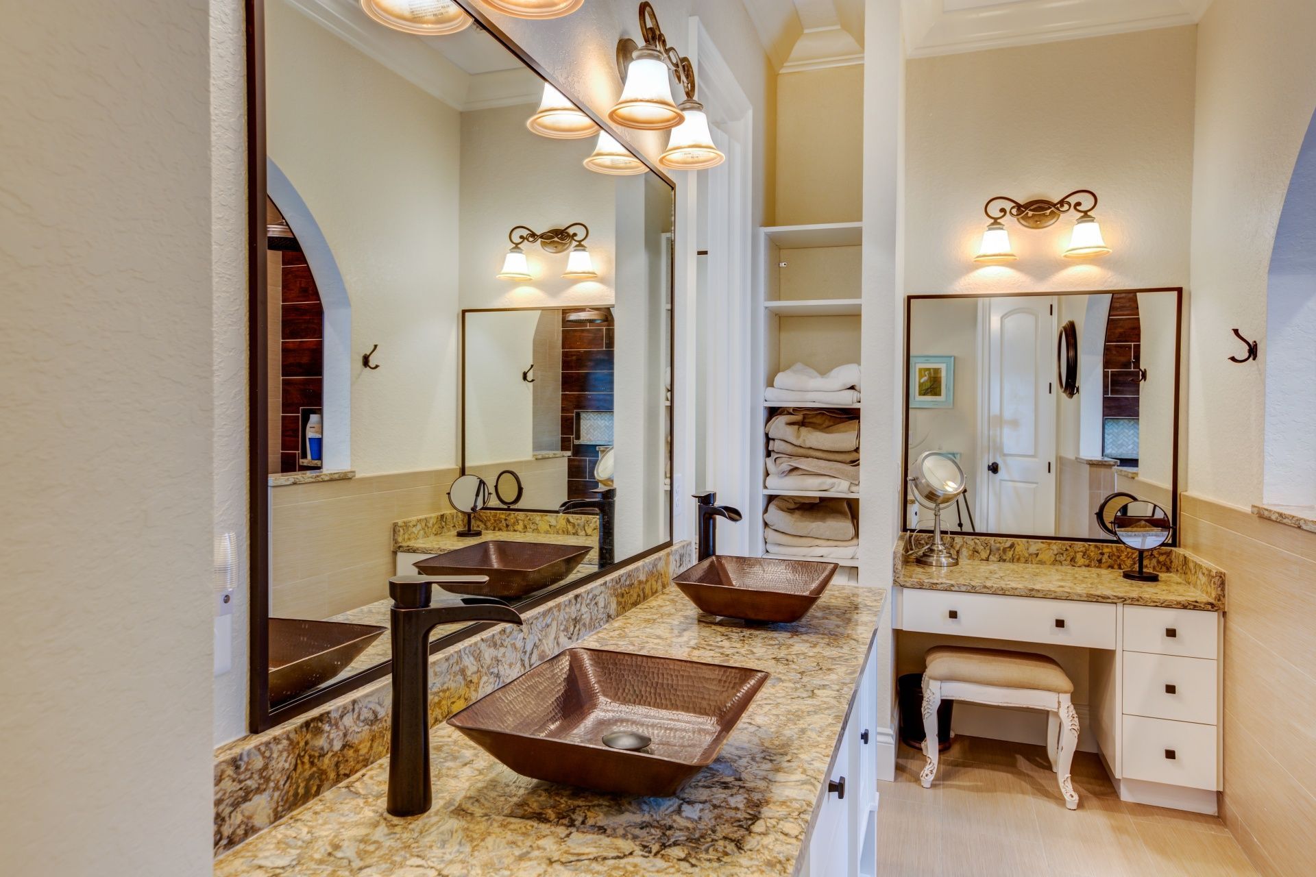 A bathroom with two sinks and two mirrors.