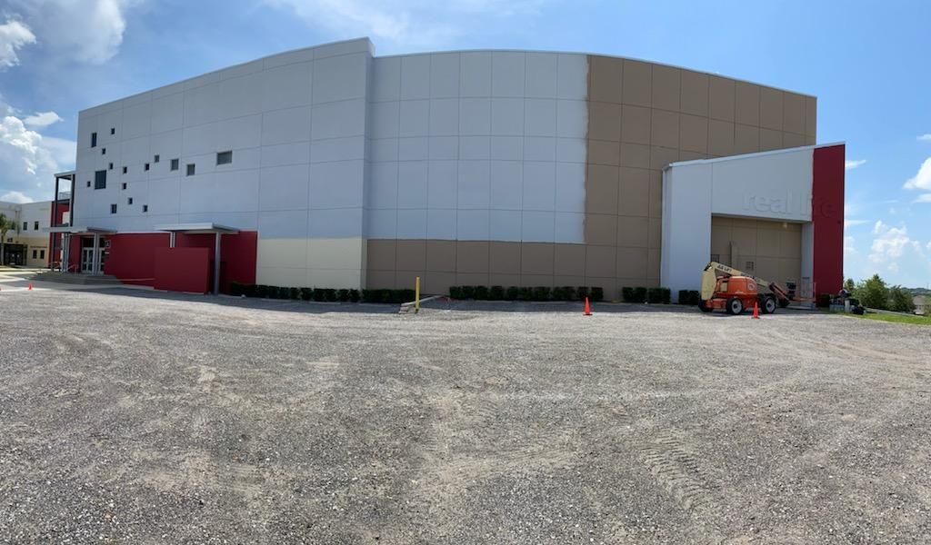 A large building with a lot of windows is being built.