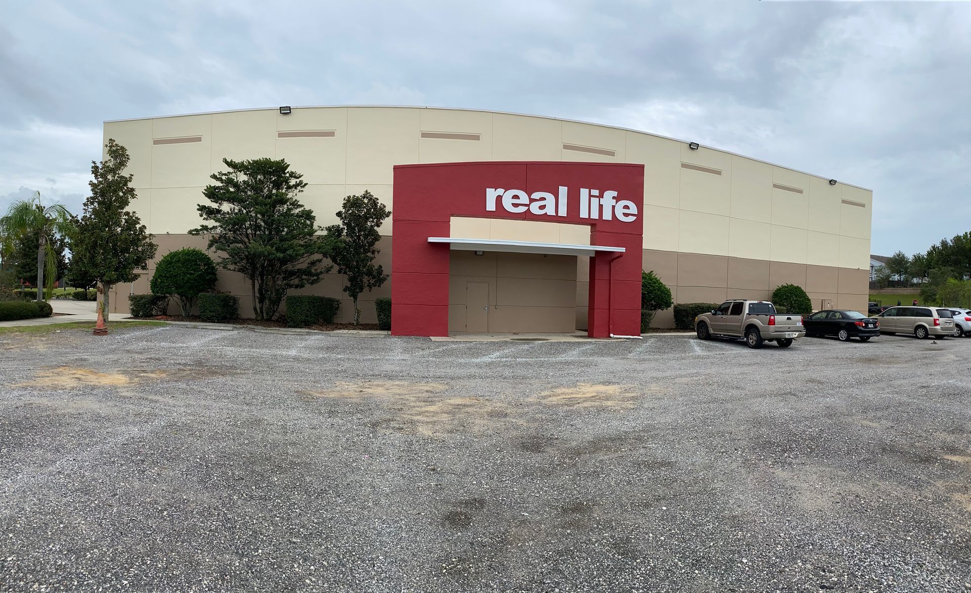 A real life store with cars parked in front of it