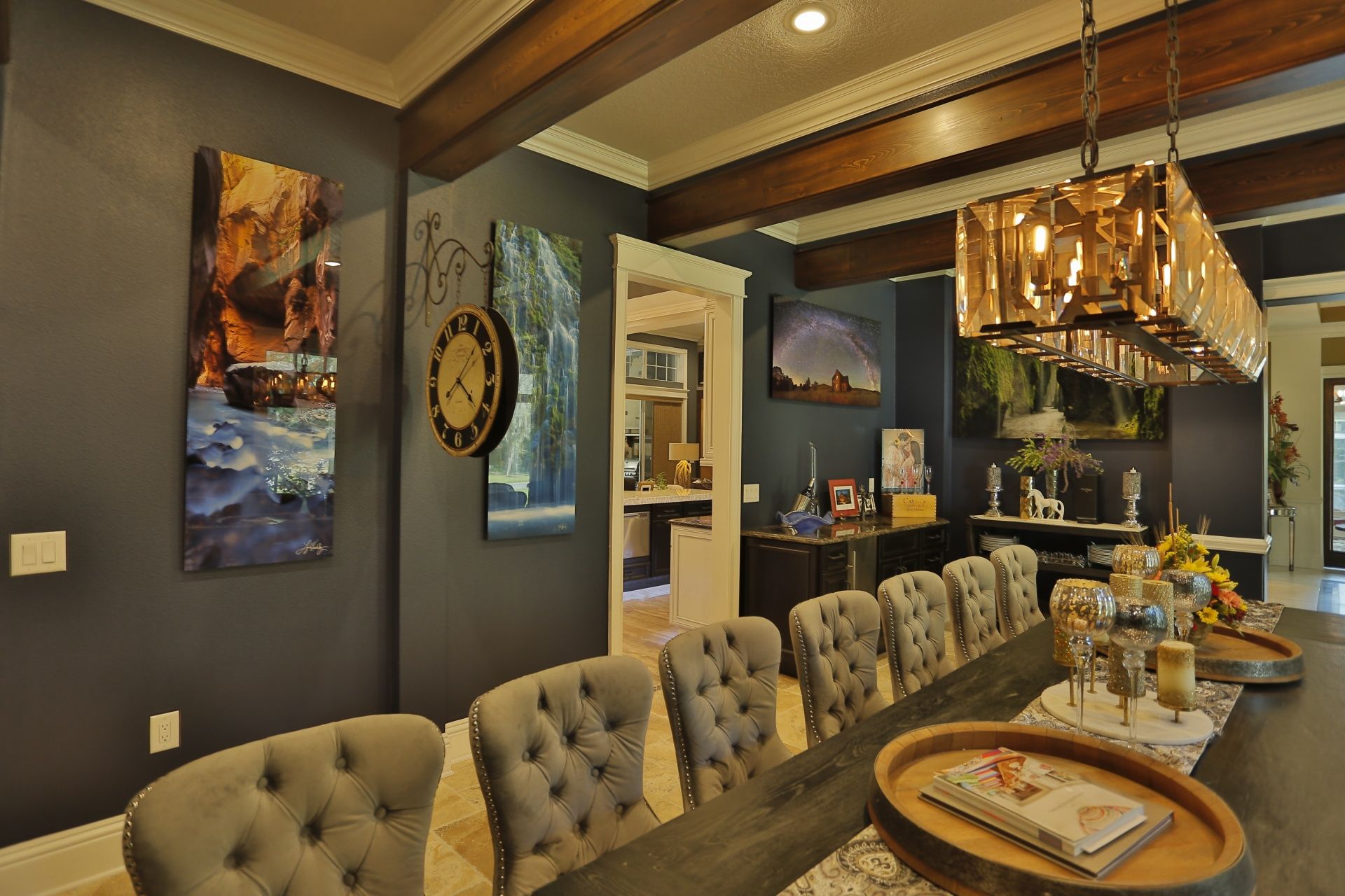 A dining room with a long table and chairs