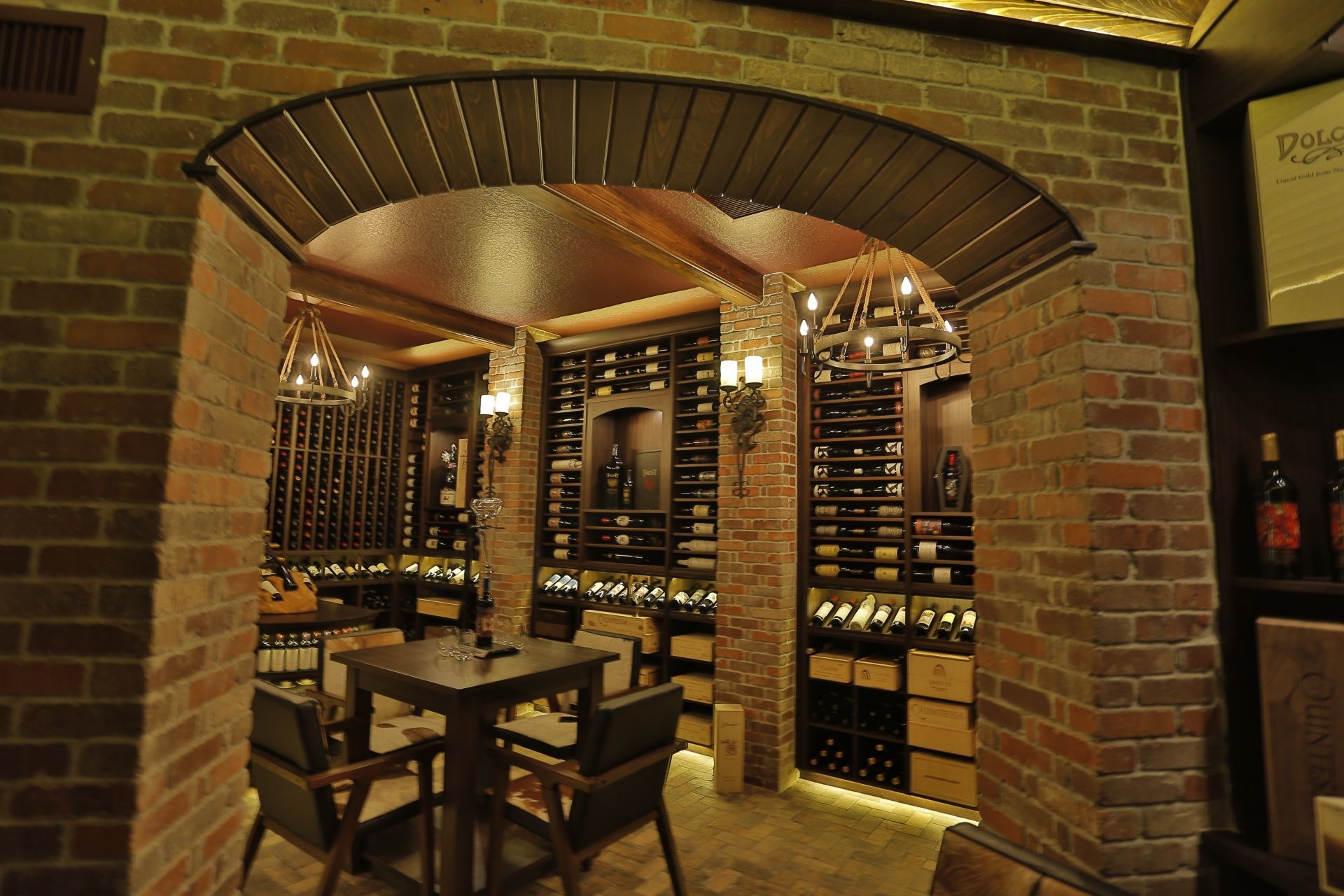 A wine cellar with tables and chairs in it