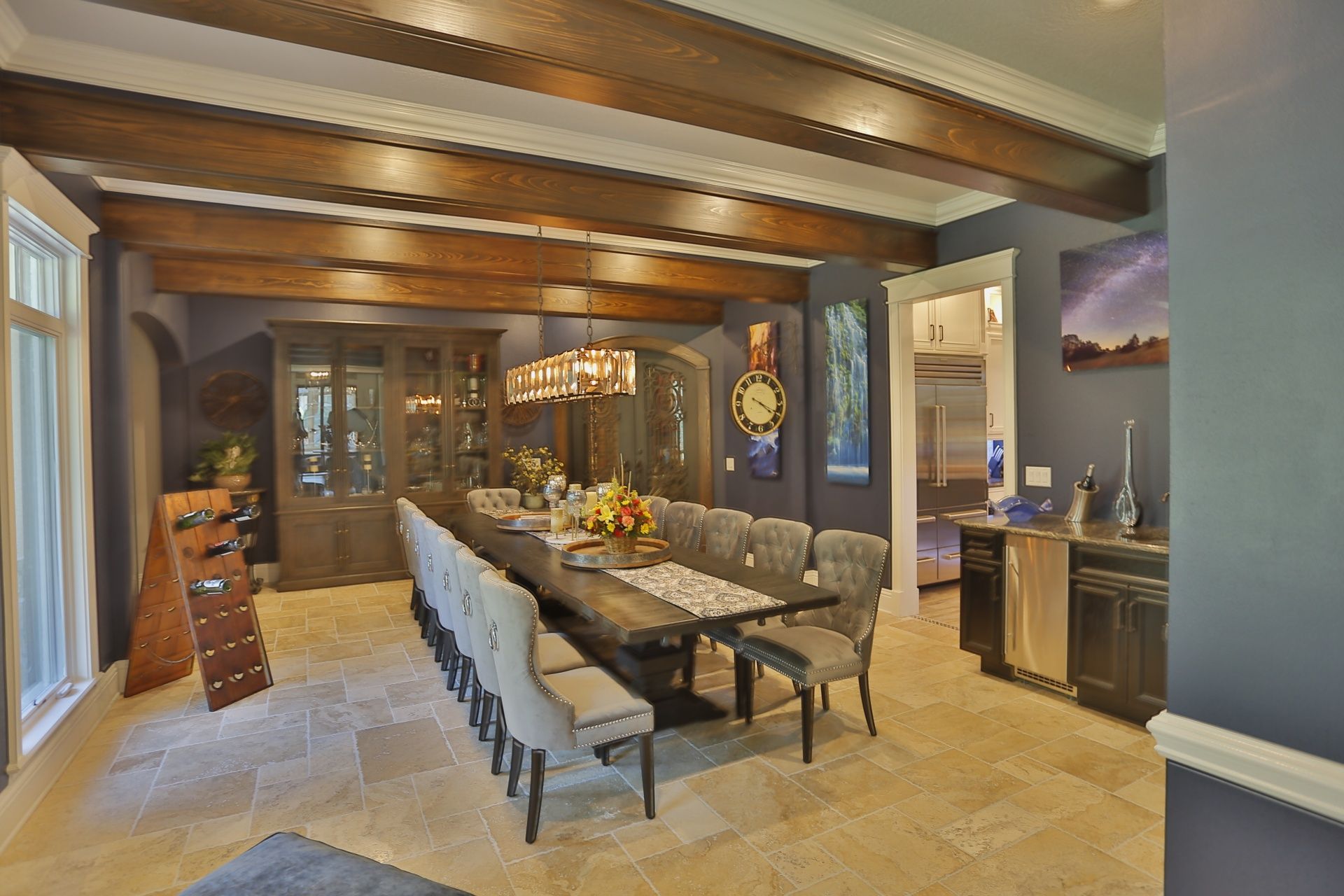 A large dining room with a long table and chairs