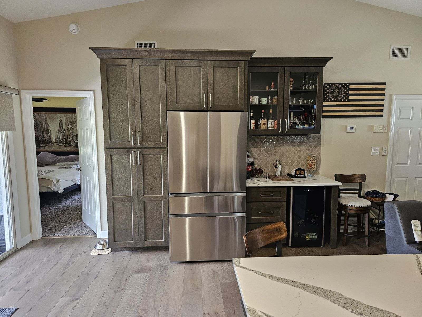 A kitchen with stainless steel appliances and wooden cabinets